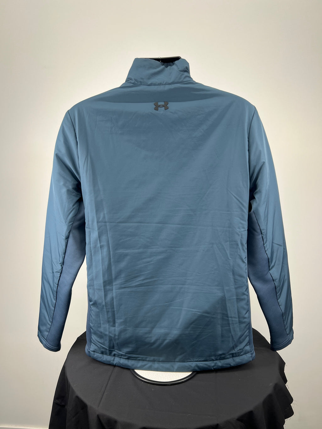 Rear view of aqua men's ColdGear Reactor jacket showing smooth back design