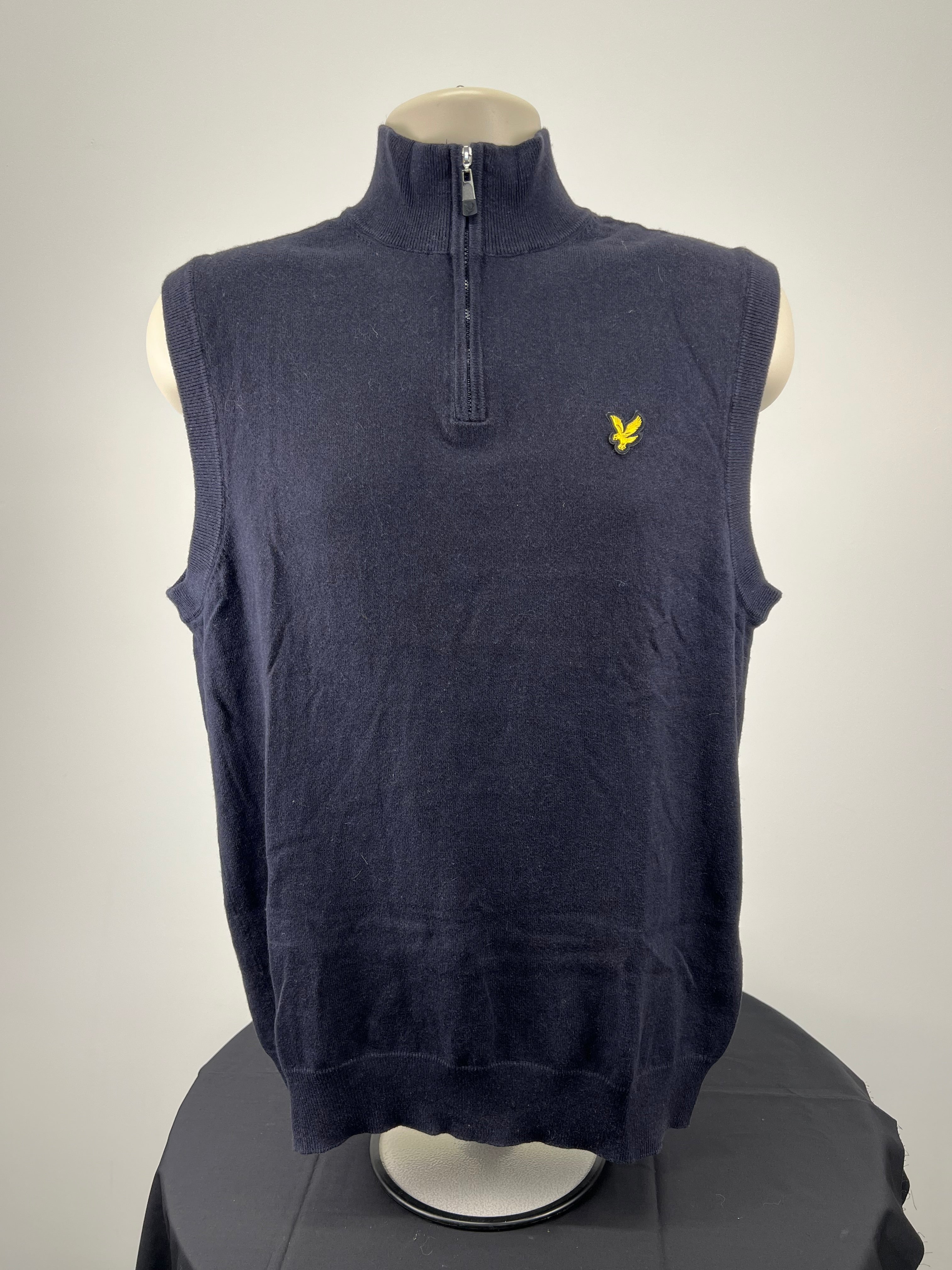 Front view of men’s navy Lyle and Scott sleeveless pullover with 1/4 zip and golden eagle logo
