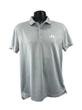 Front view of men's J.Lindeberg grey polo shirt on black mannequin showing logo on chest