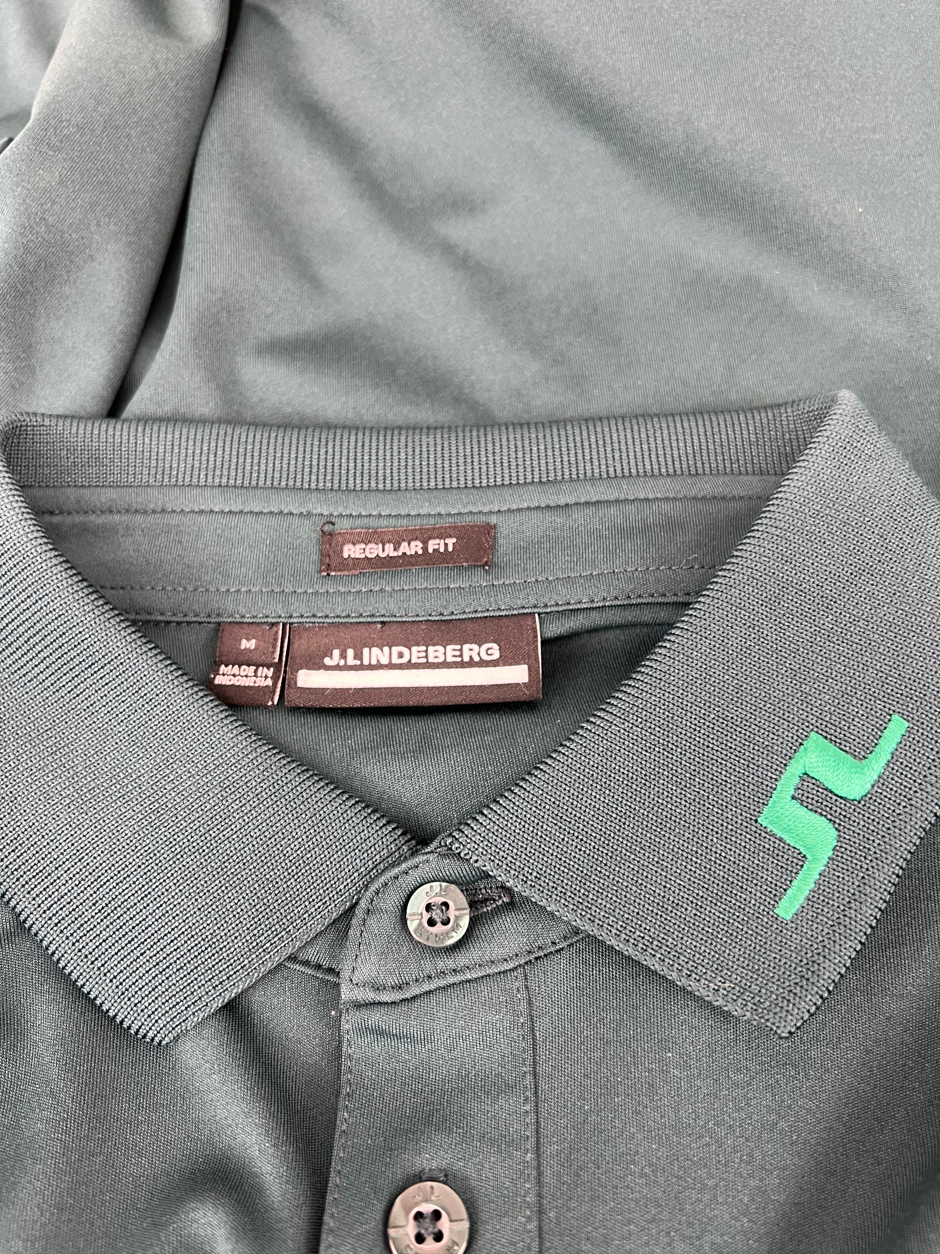 Close-up of collar button and J. Lindeberg label showing regular fit and quality detailing
