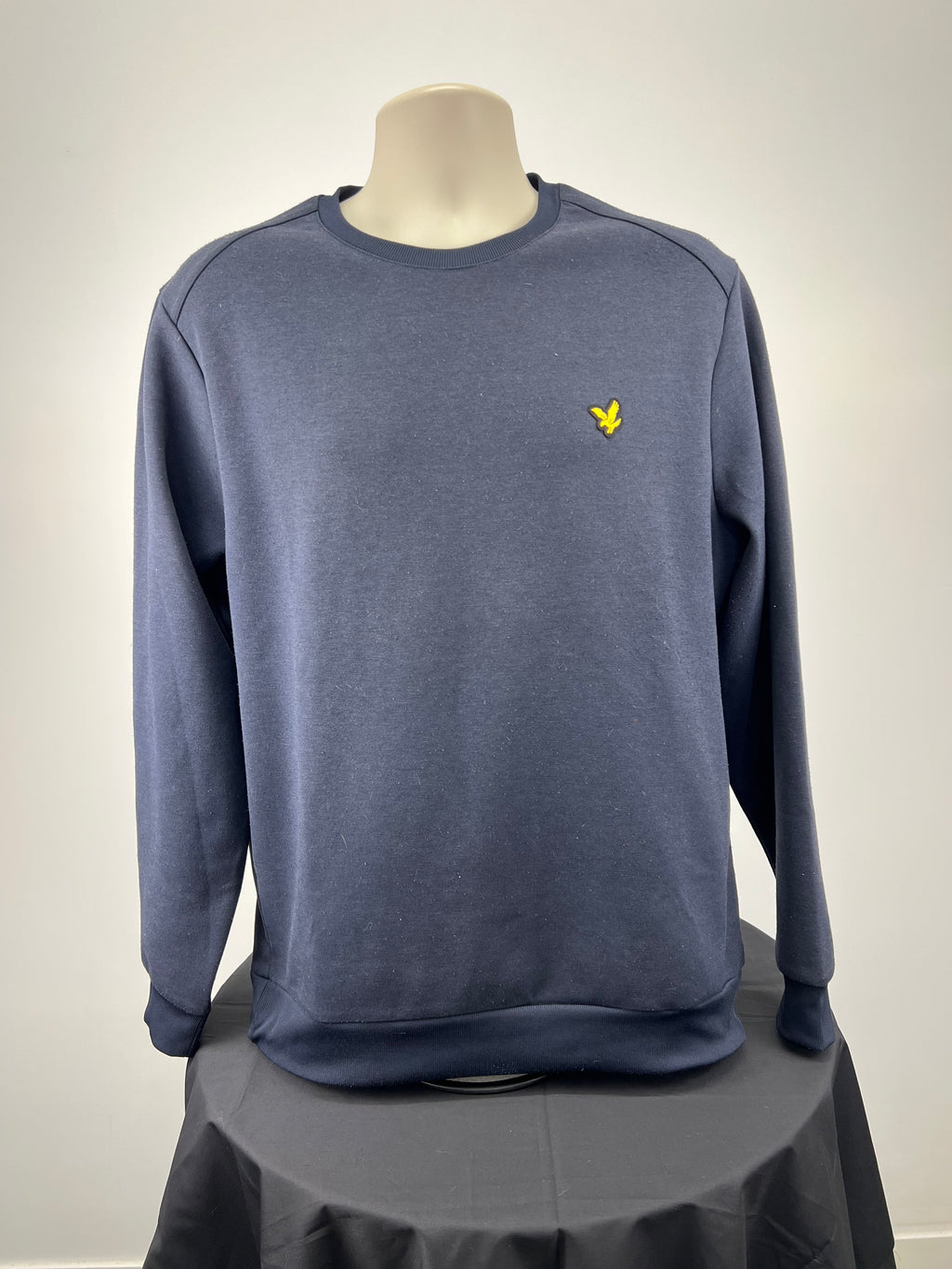 Front view of men's dark blue Lyle and Scott sweatshirt with yellow eagle logo