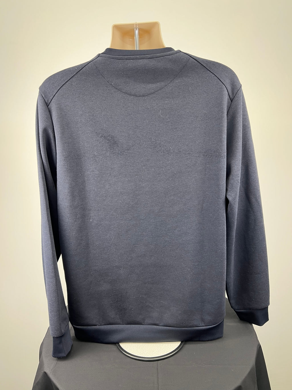 Back view of men's dark blue Lyle and Scott sweatshirt showing plain design
