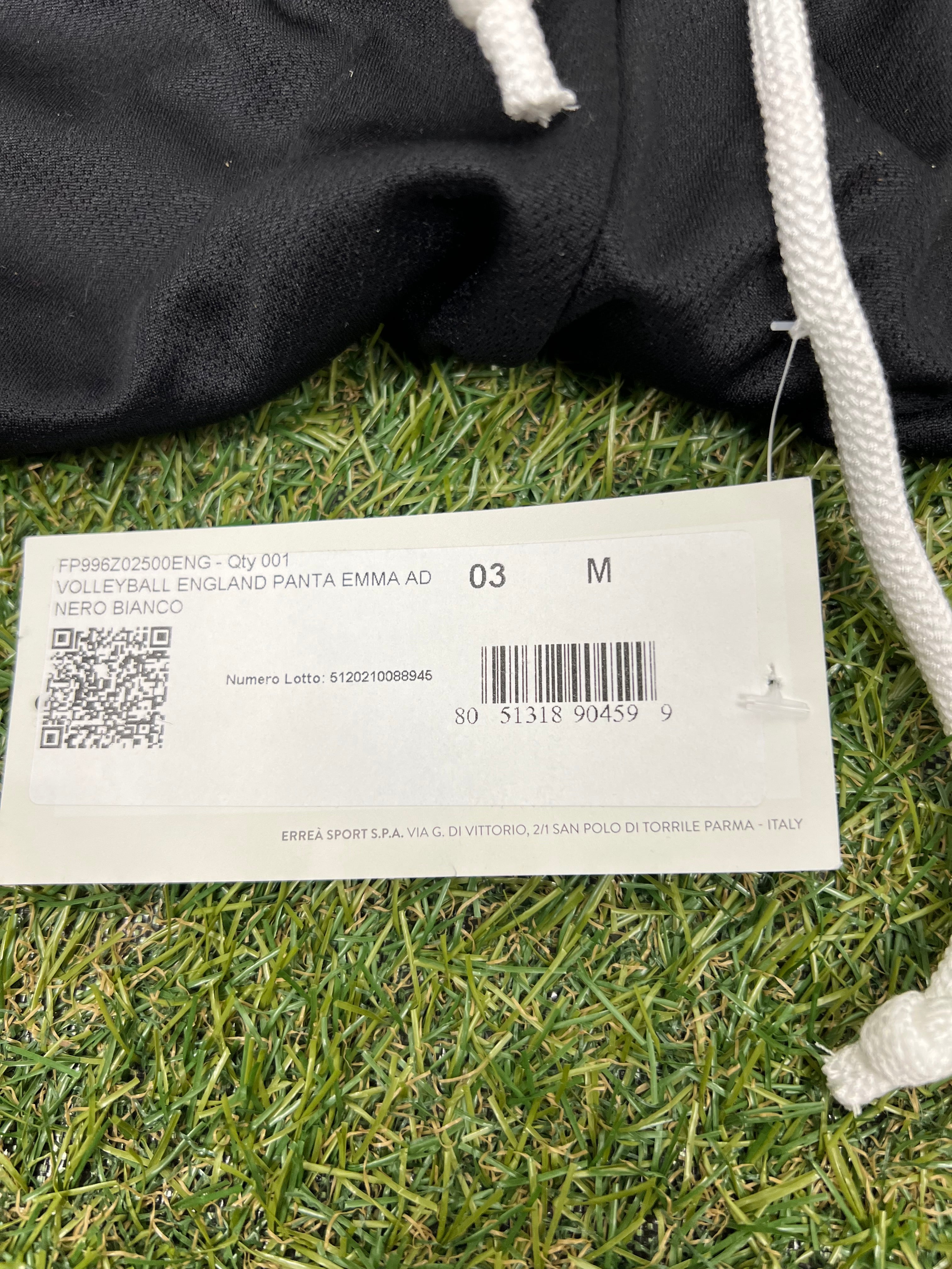 Close-up of product tag showing size M and volleyball England details