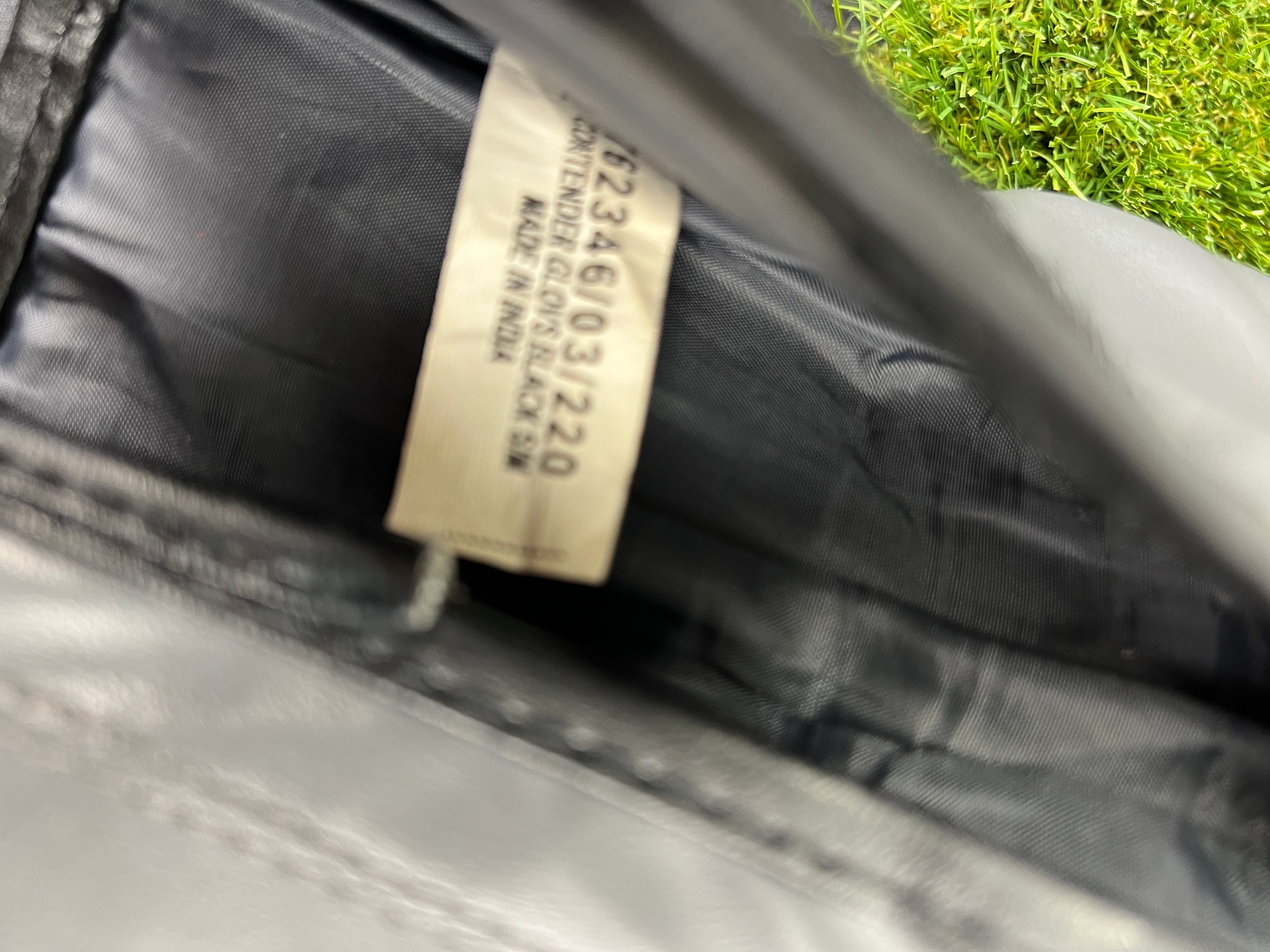 Close-up inside label of Lonsdale boxing gloves showing size S/M and made in India