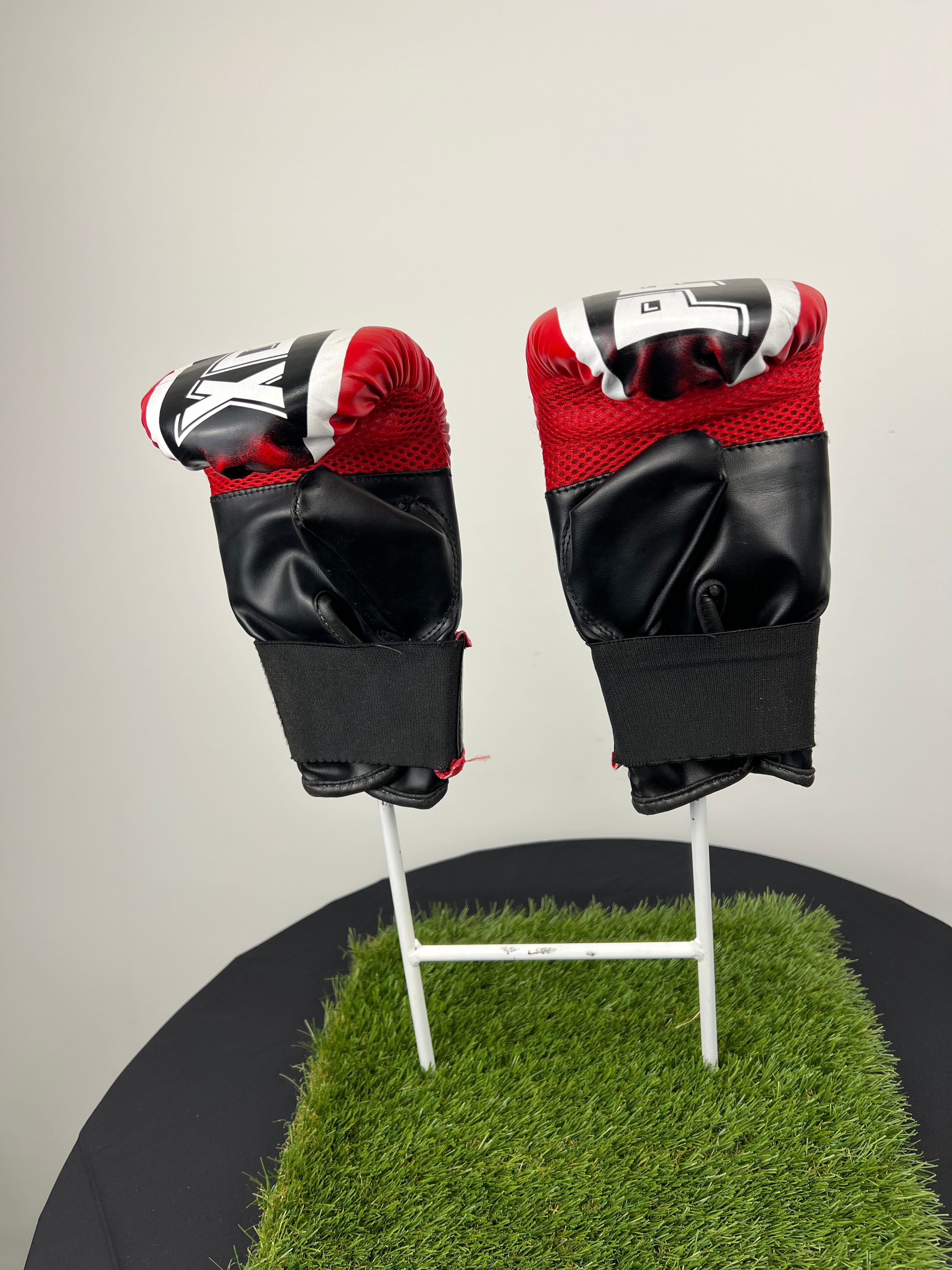 Back view of Pro Box boxing gloves showing black palm area with mesh ventilation and adjustable velcro strap