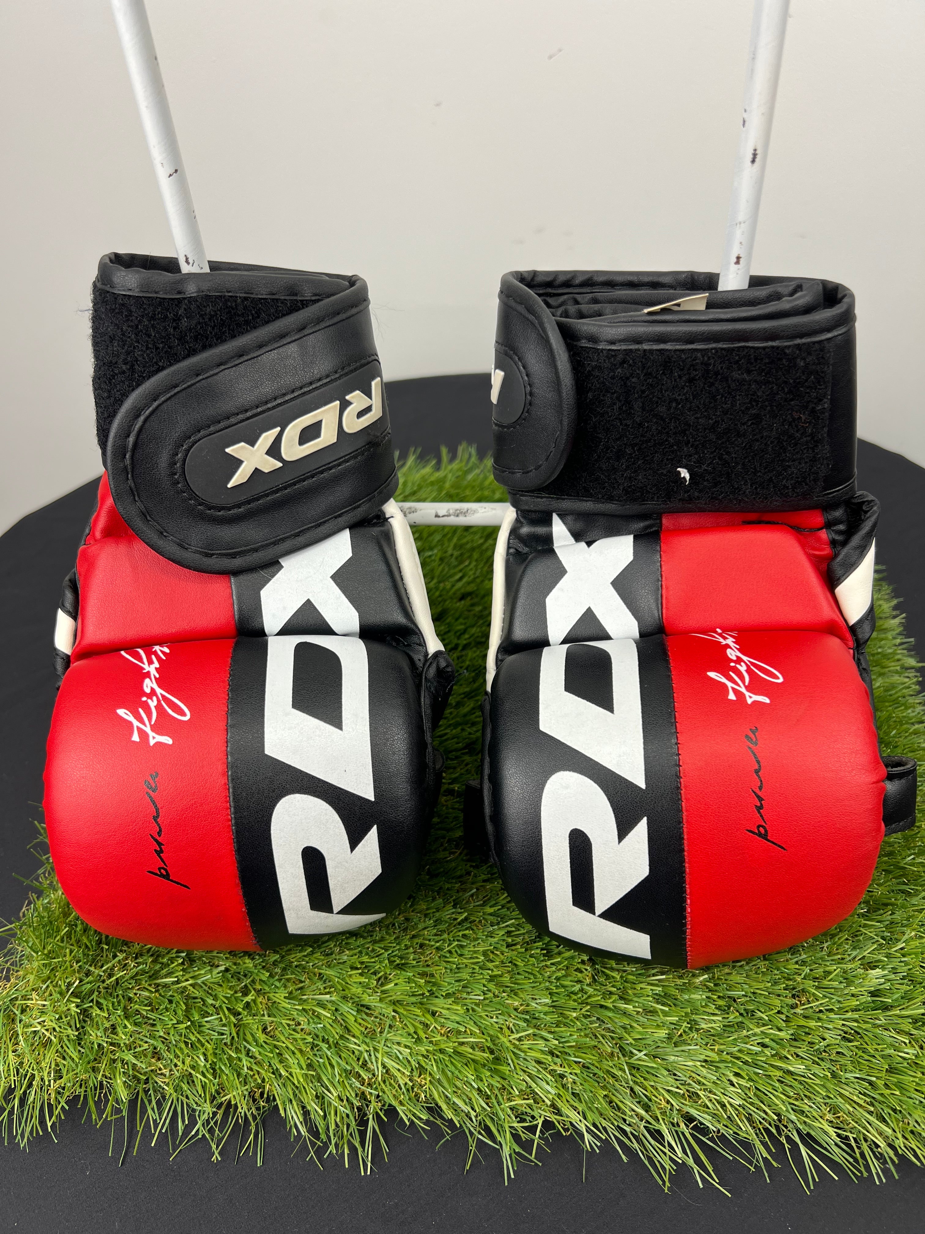Front view of RDX T6 MMA grappling gloves in red and black with bold RDX logo and Velcro wrist straps