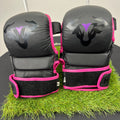 Front view of Islero MMA grappling gloves in black with pink trim and bull logo