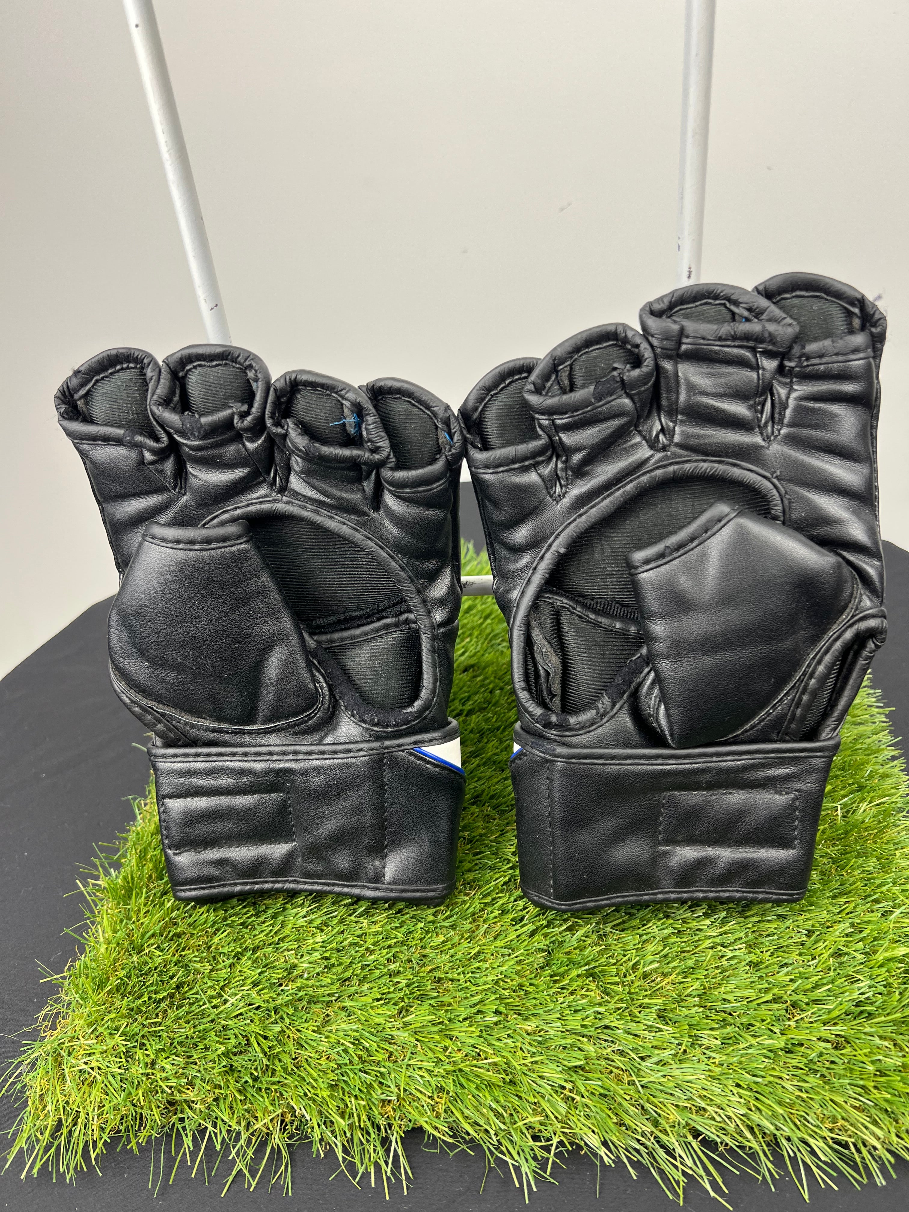 Back view of RDX F12U large grappling gloves showing fingerless design and wrist straps