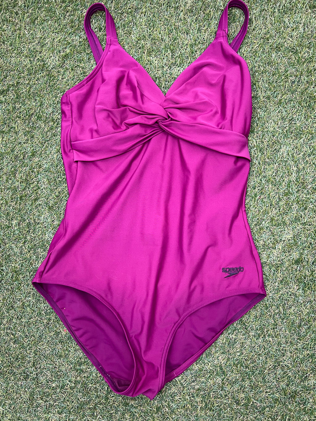Front view of a women's purple Speedo swimsuit size 16 with twisted front design and adjustable straps