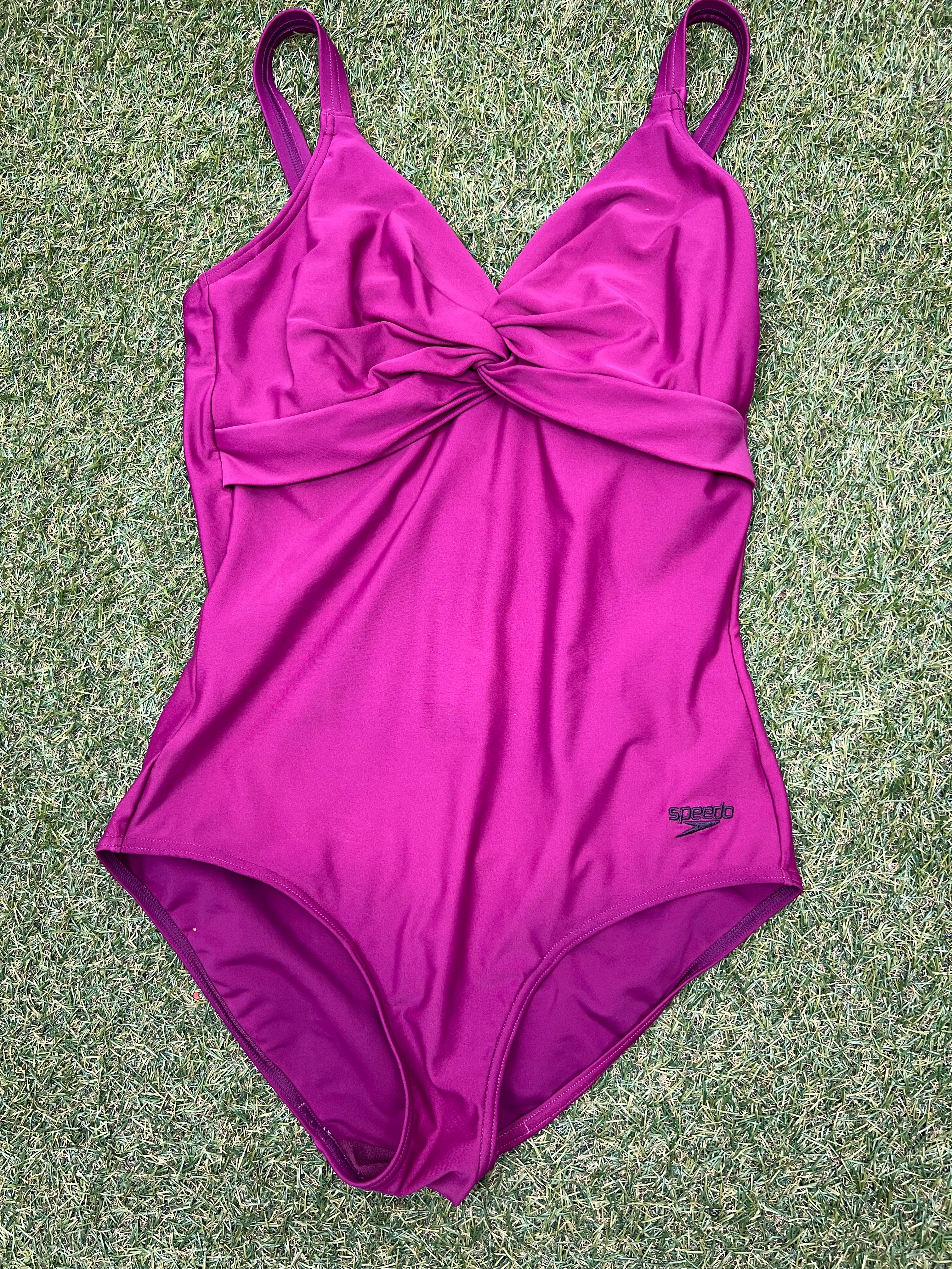 Front view of a women's purple Speedo swimsuit size 16 with twisted front design and adjustable straps
