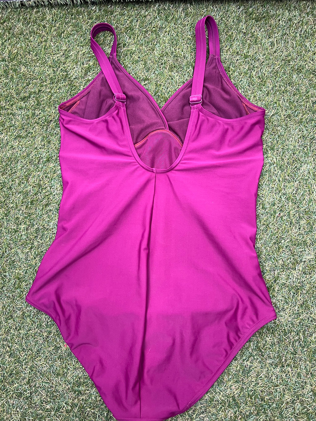 Back view of a women's purple Speedo swimsuit size 16 showing open back and strap details