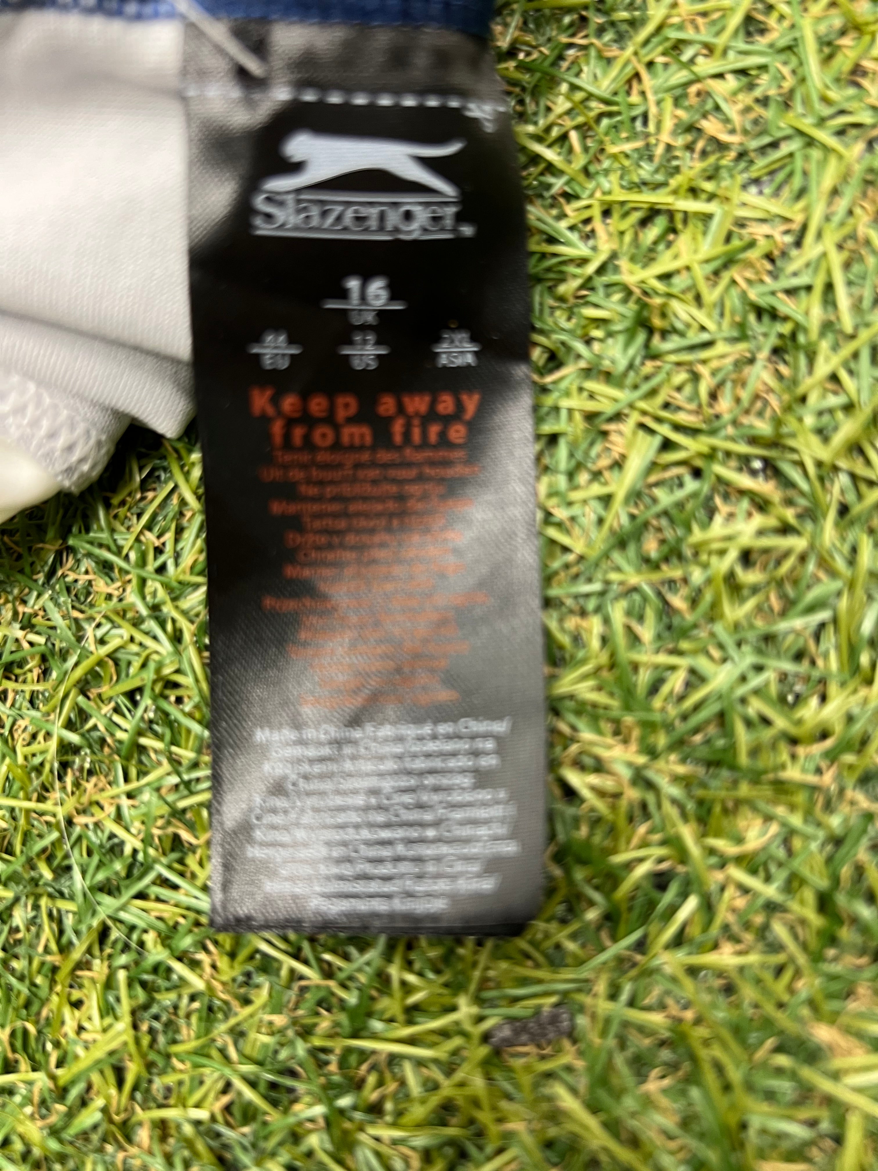 Close-up of Slazenger swimsuit label showing size 16 and care instructions