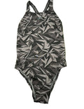 Front view of women's Speedo one-piece swimsuit with black and grey geometric pattern on grass