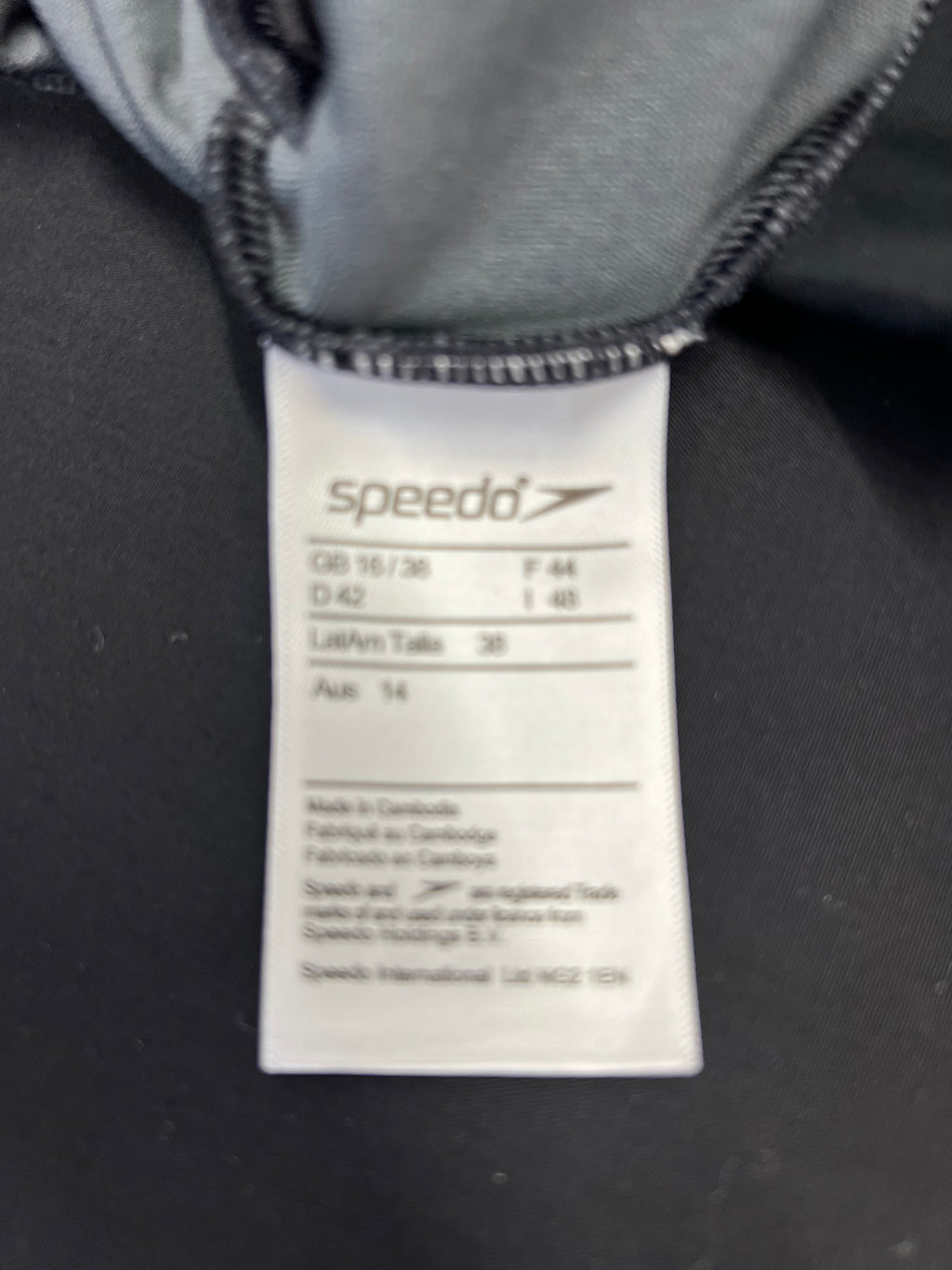 Close-up of Speedo swimsuit label showing size 16 and product details