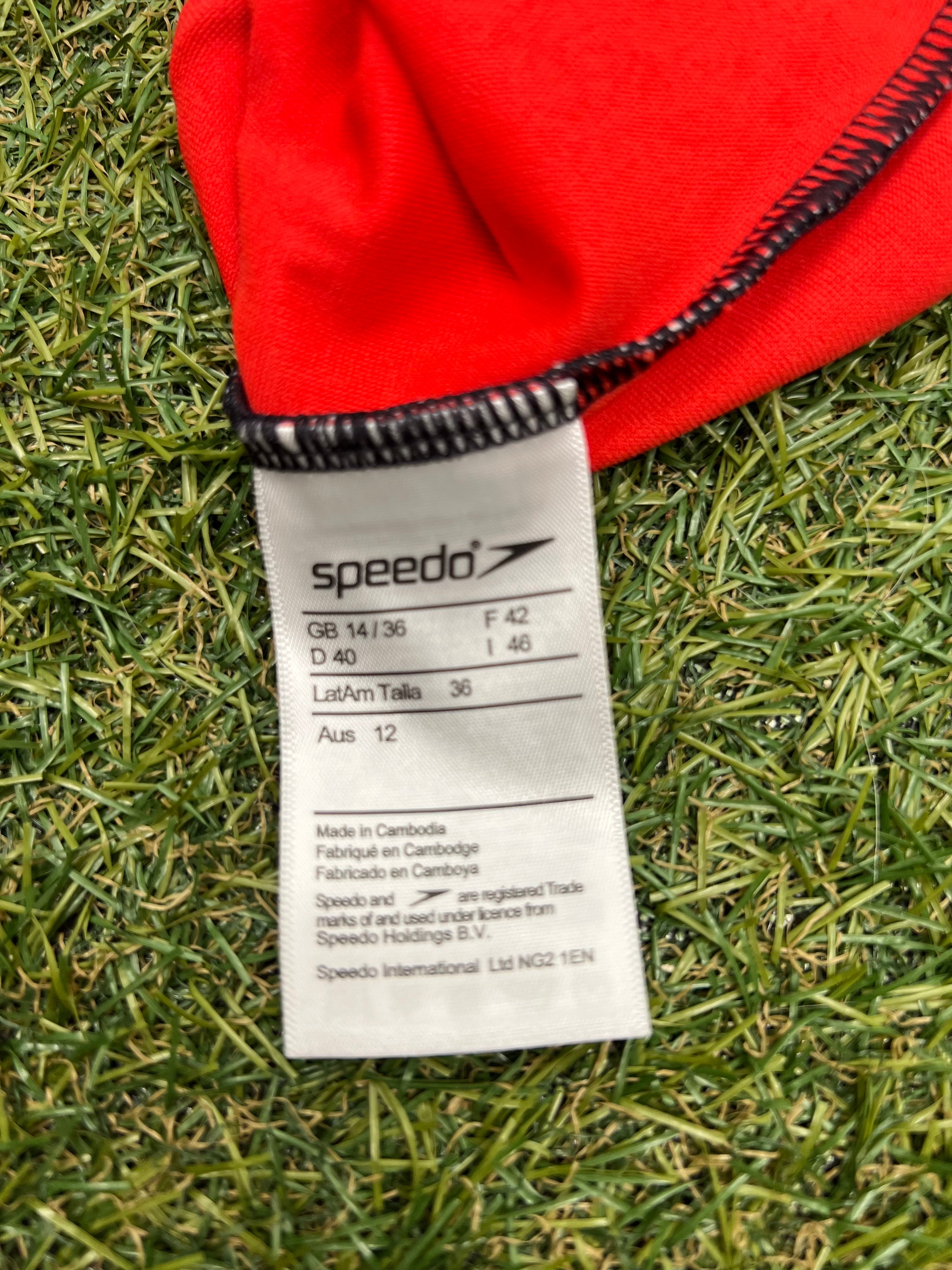 Close-up of Speedo swimsuit size and care label showing size 14 and made in Cambodia