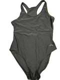Front view of women’s black Slazenger one-piece swimsuit size 16 laid on grass