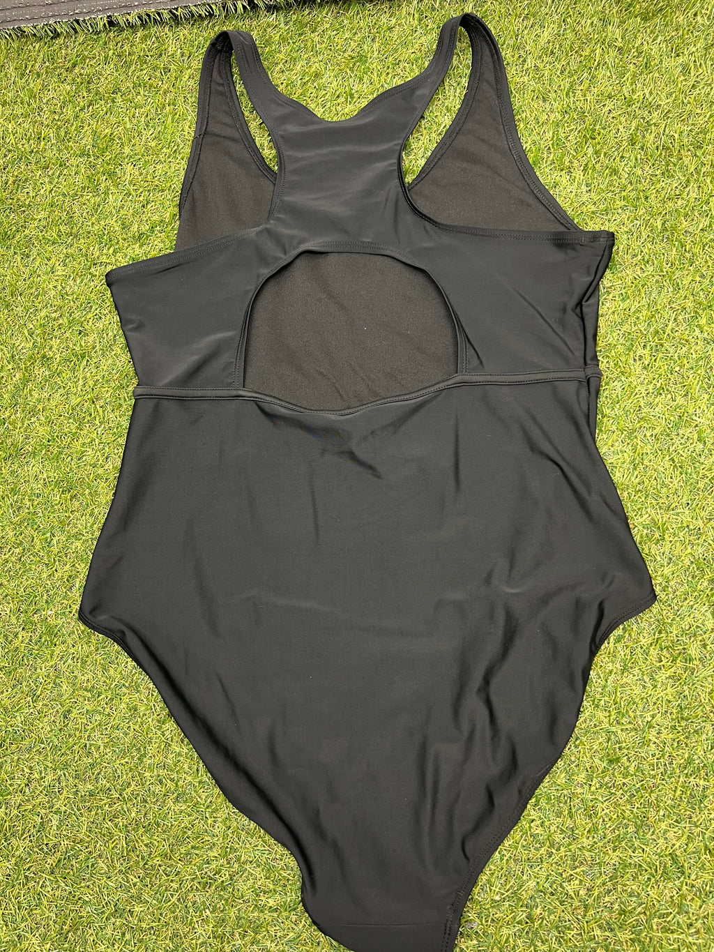 Back view of women’s black Slazenger swimsuit showing racerback and keyhole design