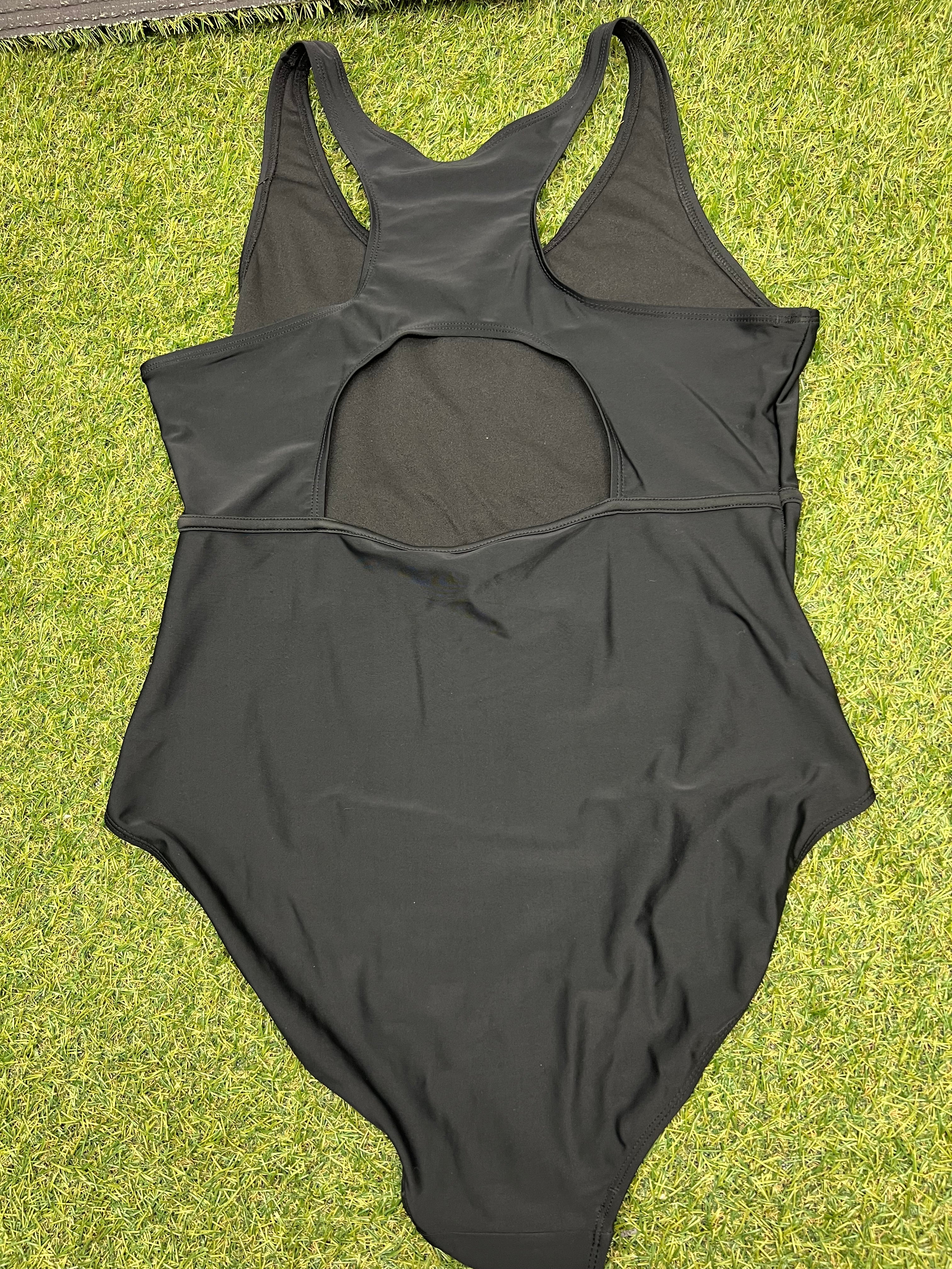 Back view of women’s black Slazenger swimsuit showing racerback and keyhole design