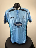 Front view of Sussex Sharks light blue cricket shirt with dark navy accents and Farnrise Construction logo