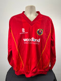 Front view of red Essex Eagles long sleeve cricket jumper with yellow piping and team crest