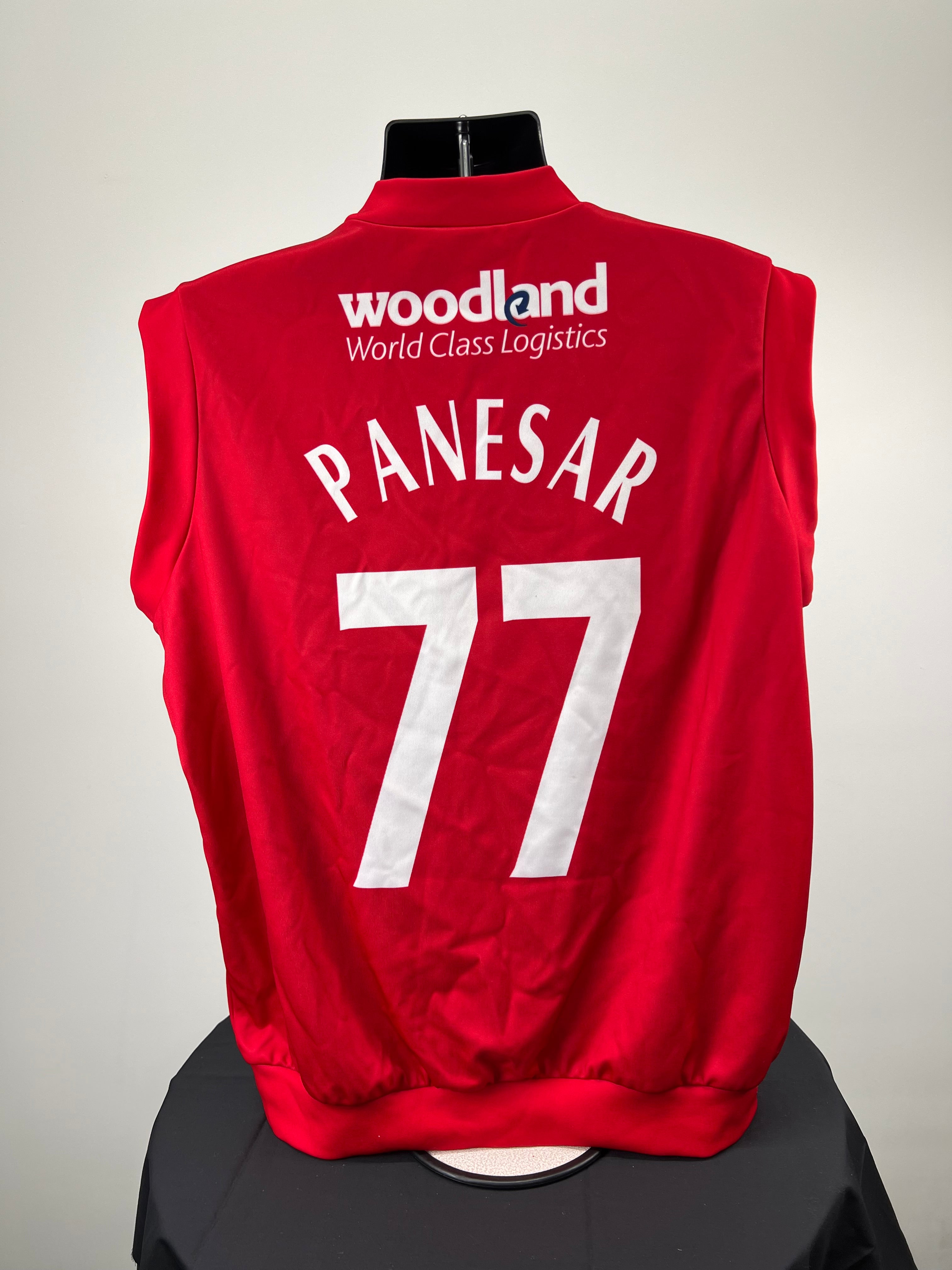 Back of cricket slipover showing Panesar name and number 77 with Woodland World Class Logistics sponsor in white