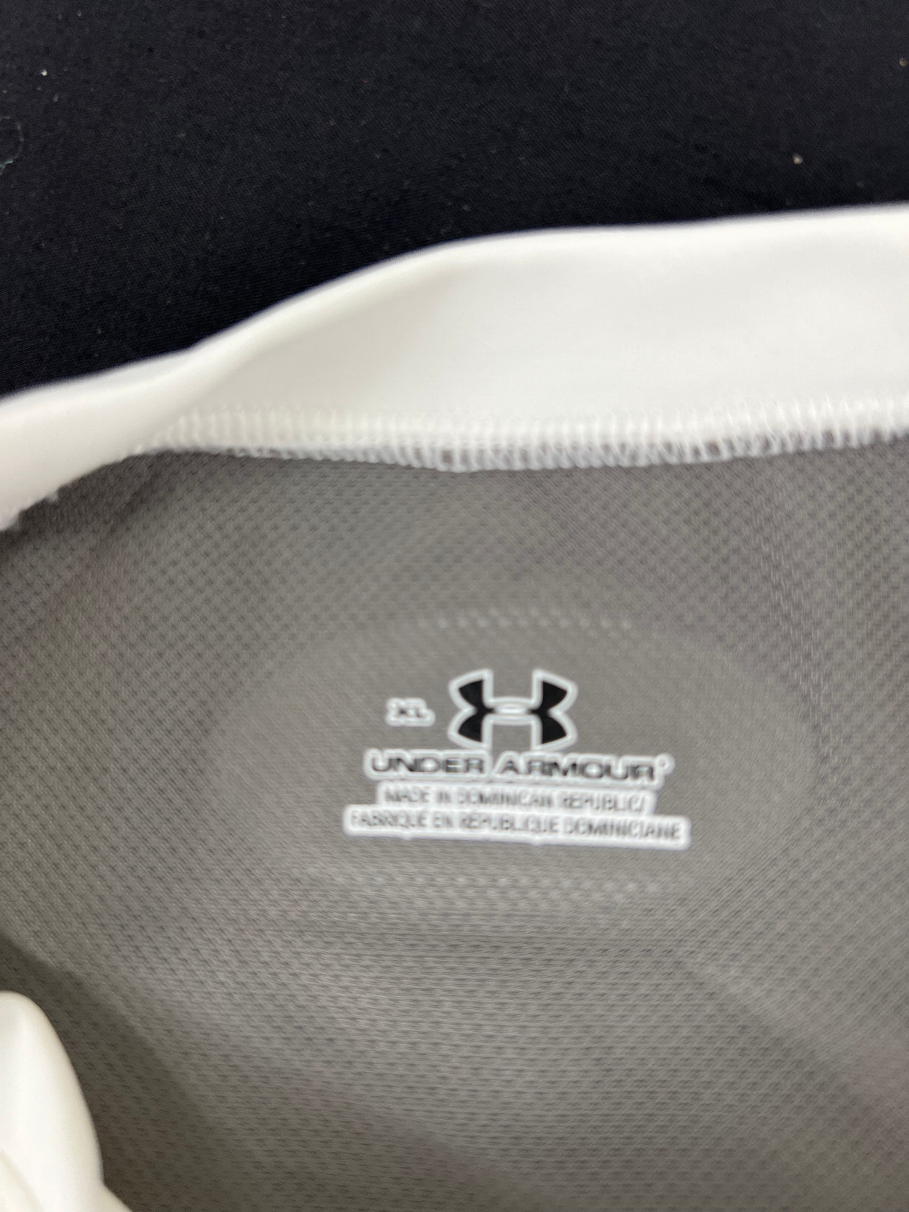Close-up of inside label showing Under Armour branding and manufacturing details