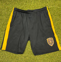 Front view of black Punjab Royal sports shorts with gold side stripes and team badge