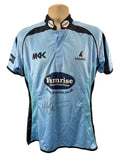 Front view of Sussex Sharks cricket shirt in sky blue with black trims, signed by Monty Panesar