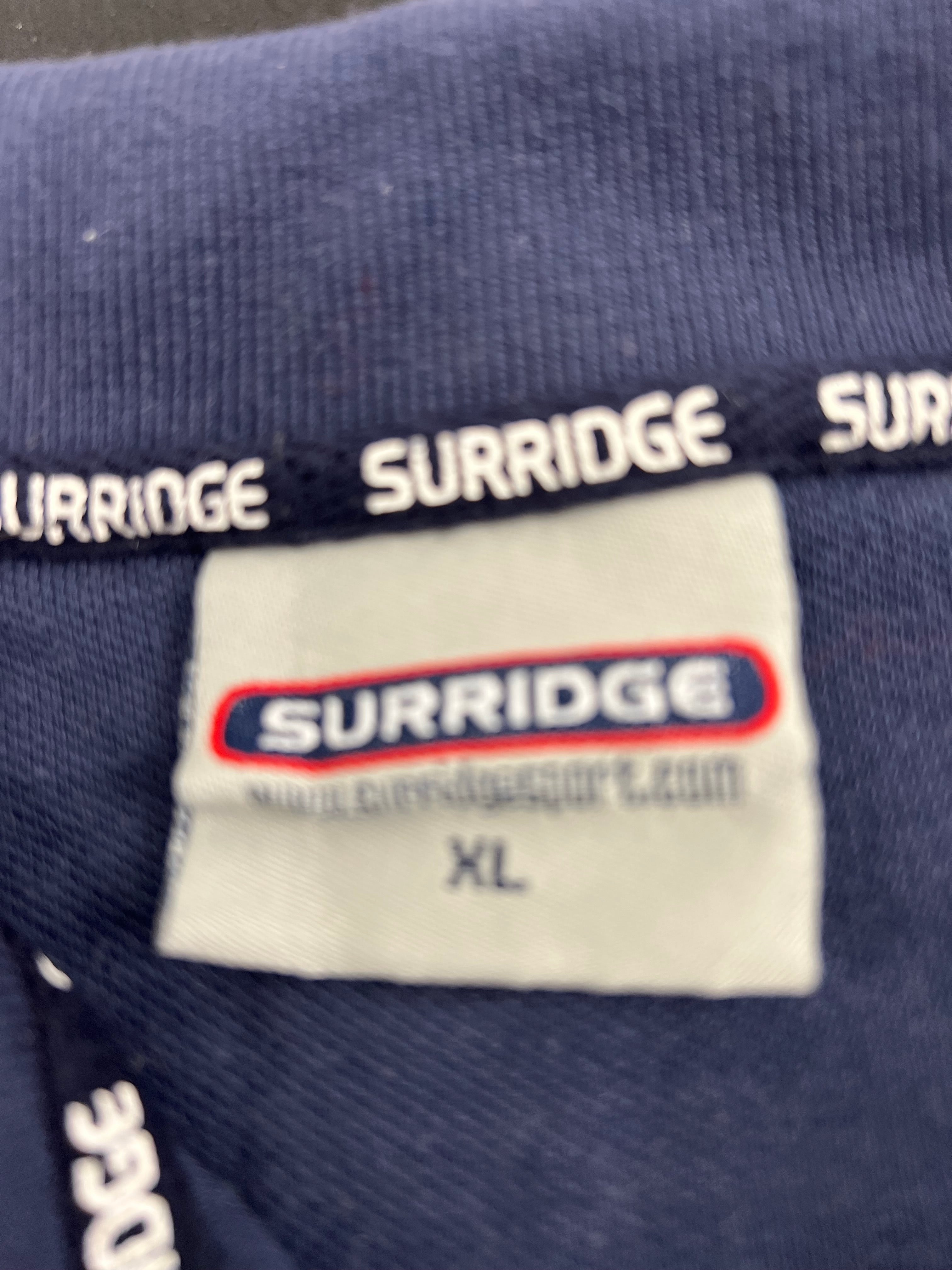 Close-up of Suridge brand label inside the neck of Northants cricket polo shirt size XL
