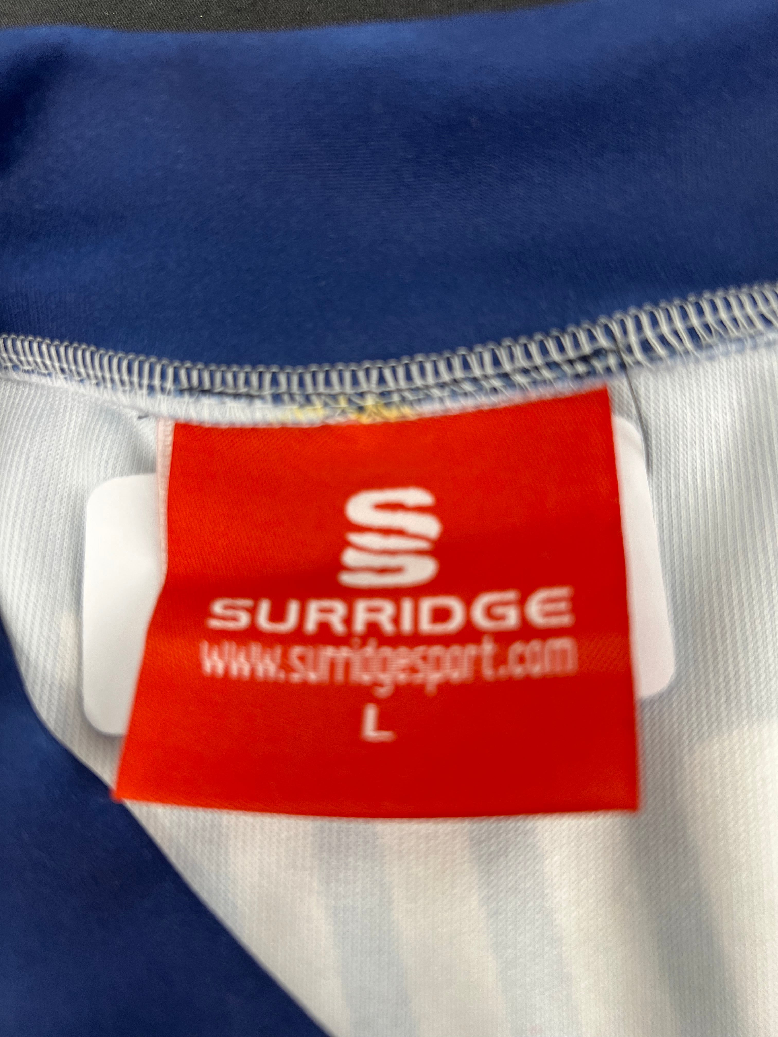 Close-up of Surridge brand label inside the Essex Eagles vest marked size L