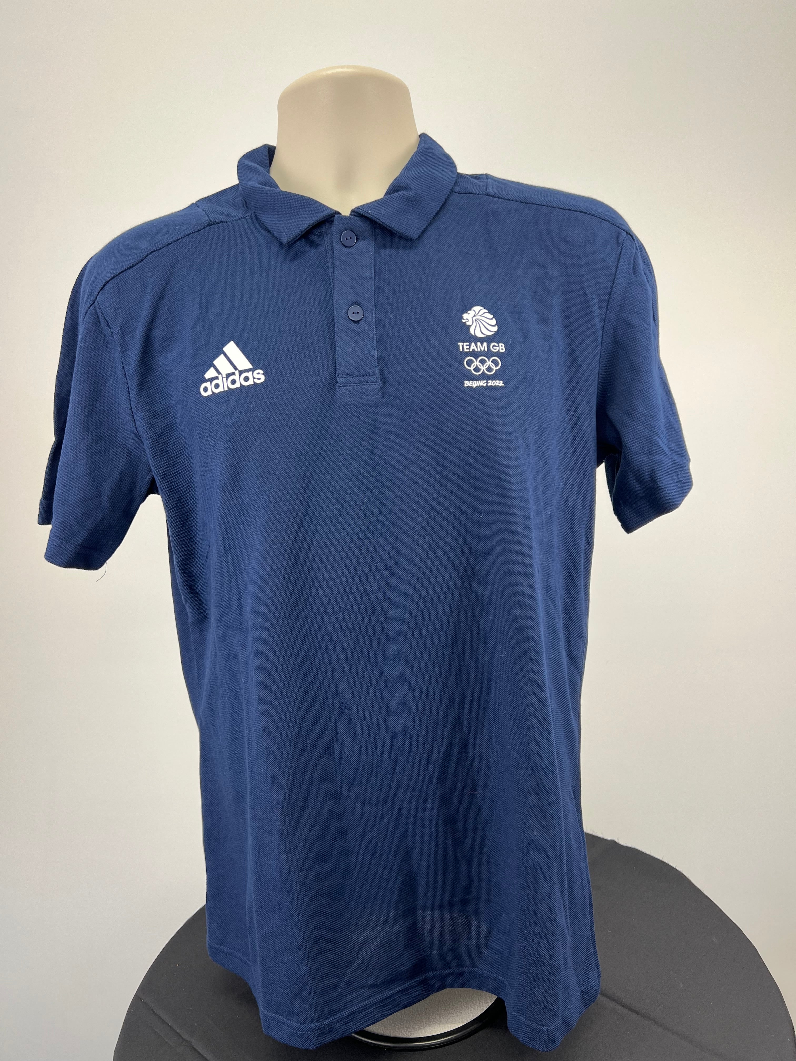 Front view of Adidas Team GB polo shirt in indigo blue with Adidas logo and Team GB emblem