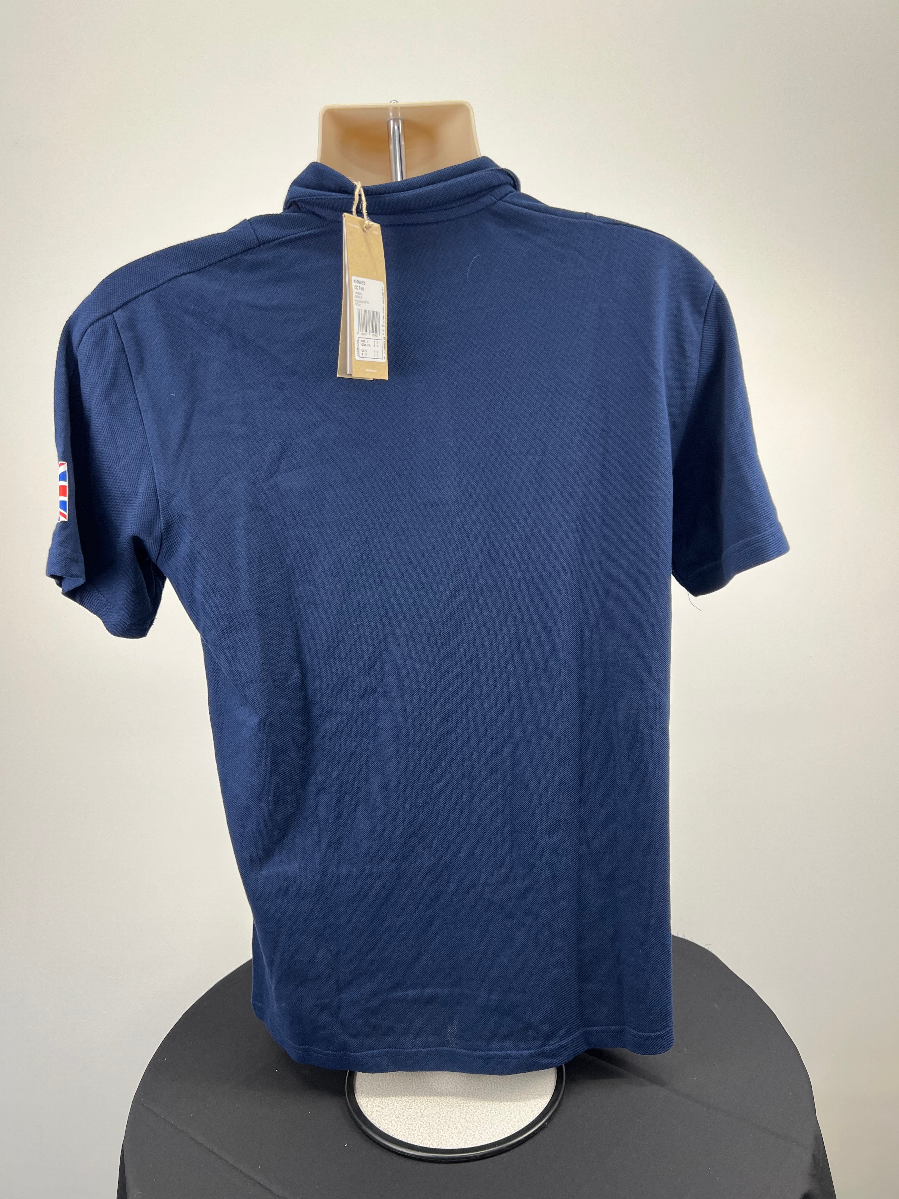 Back view of the indigo Adidas Team GB polo shirt showing plain design with tag attached