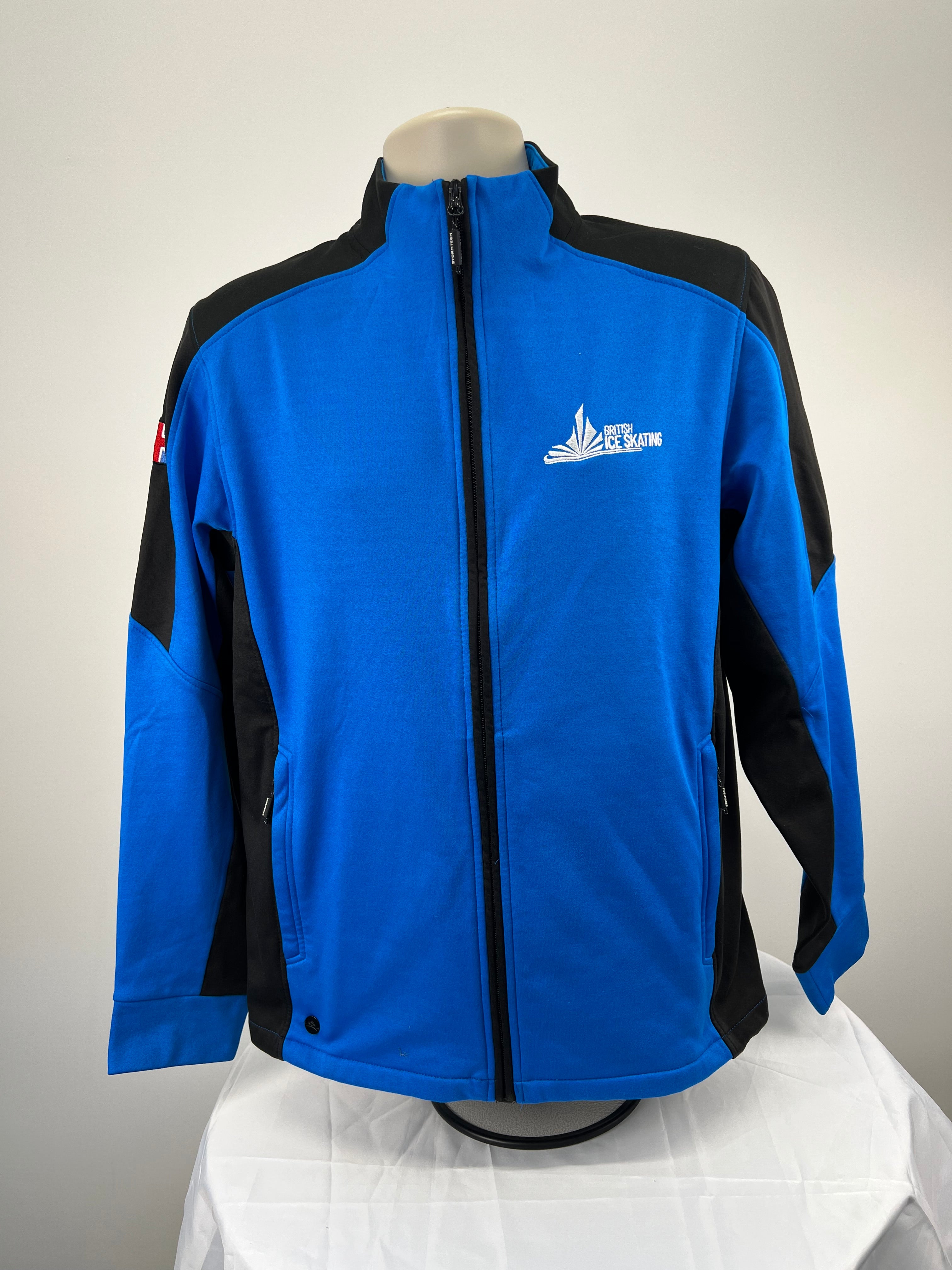 Front view of Team GB British Ice Skating Stormtech performance jacket in blue and black with zip closure