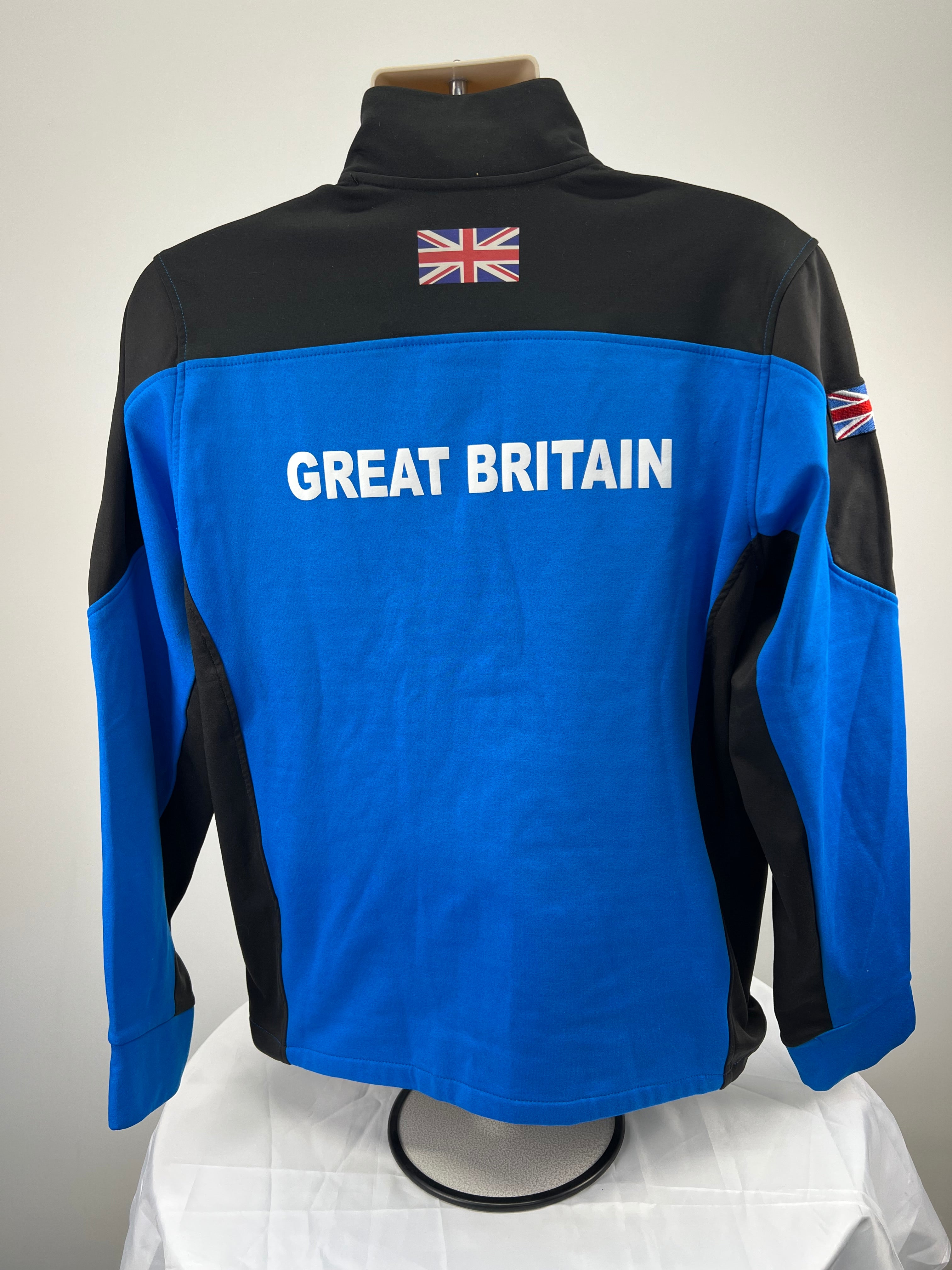 Back view of the jacket showing GREAT BRITAIN print and Union Jack flag on upper back