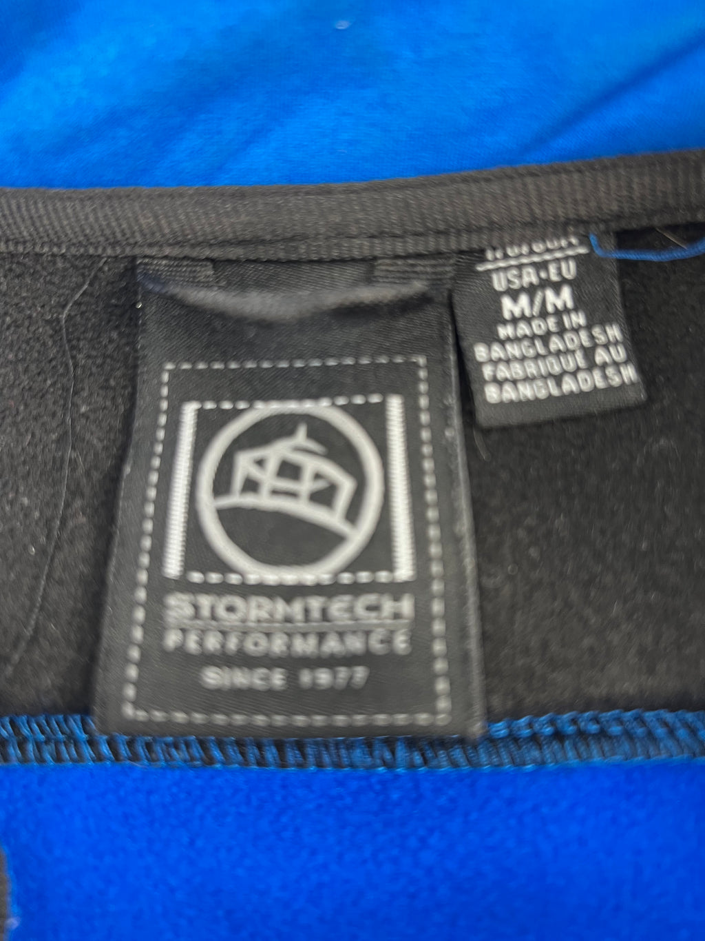 Stormtech Performance label and size tag inside the jacket collar