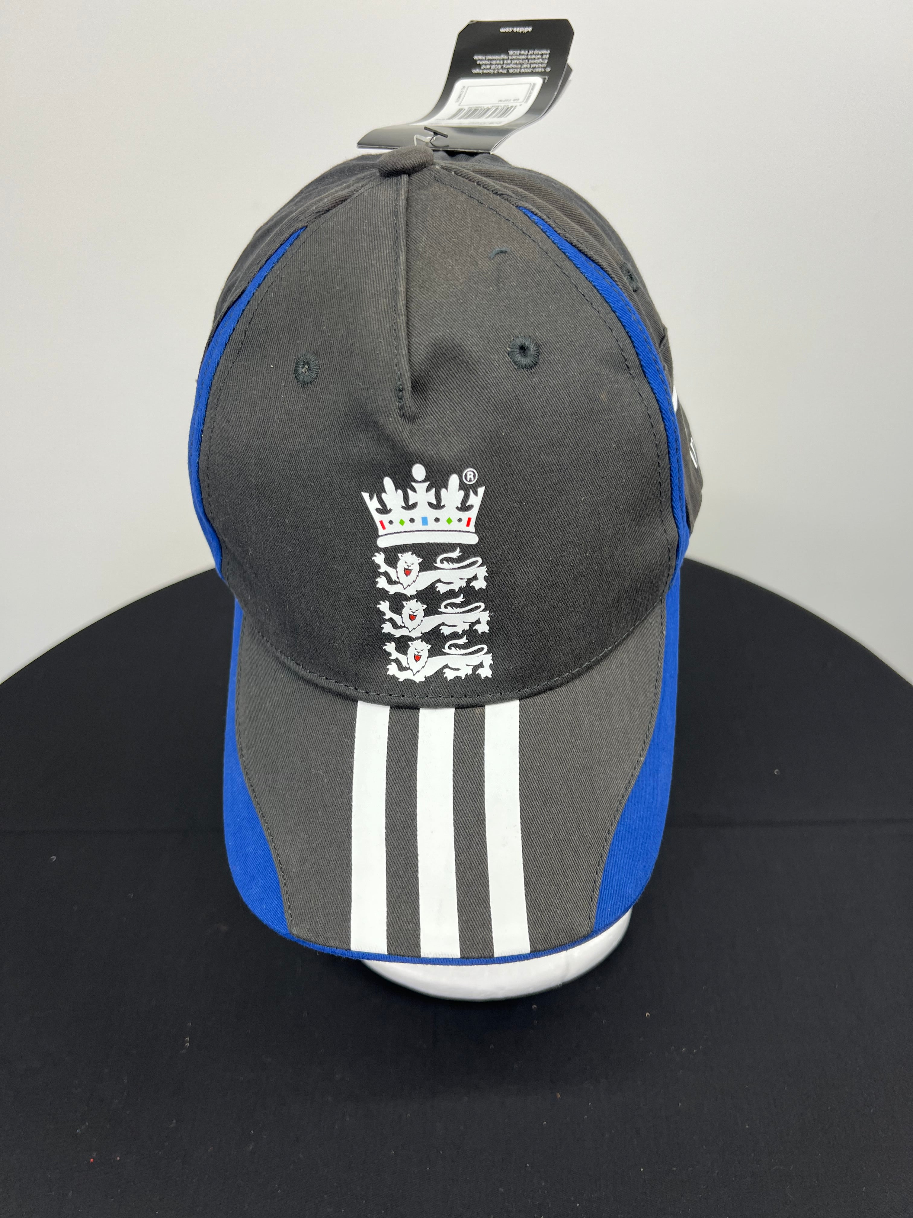 Front view of black and blue England cricket adidas baseball cap with white three stripes and England cricket crest