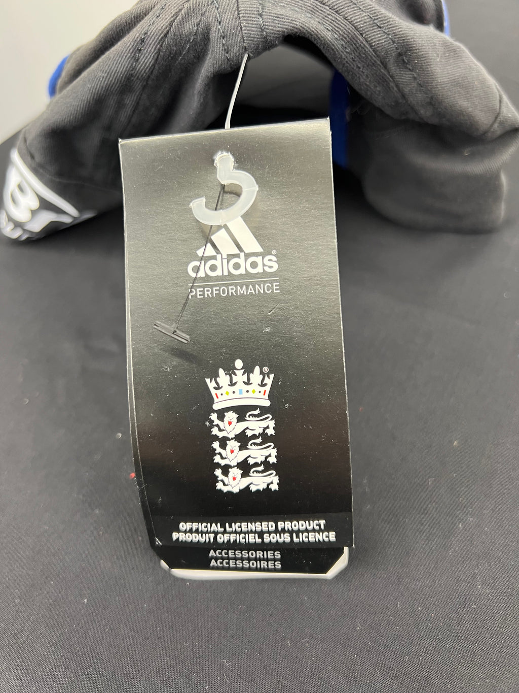 Close-up of adidas performance tag on Official Licensed England cricket cap