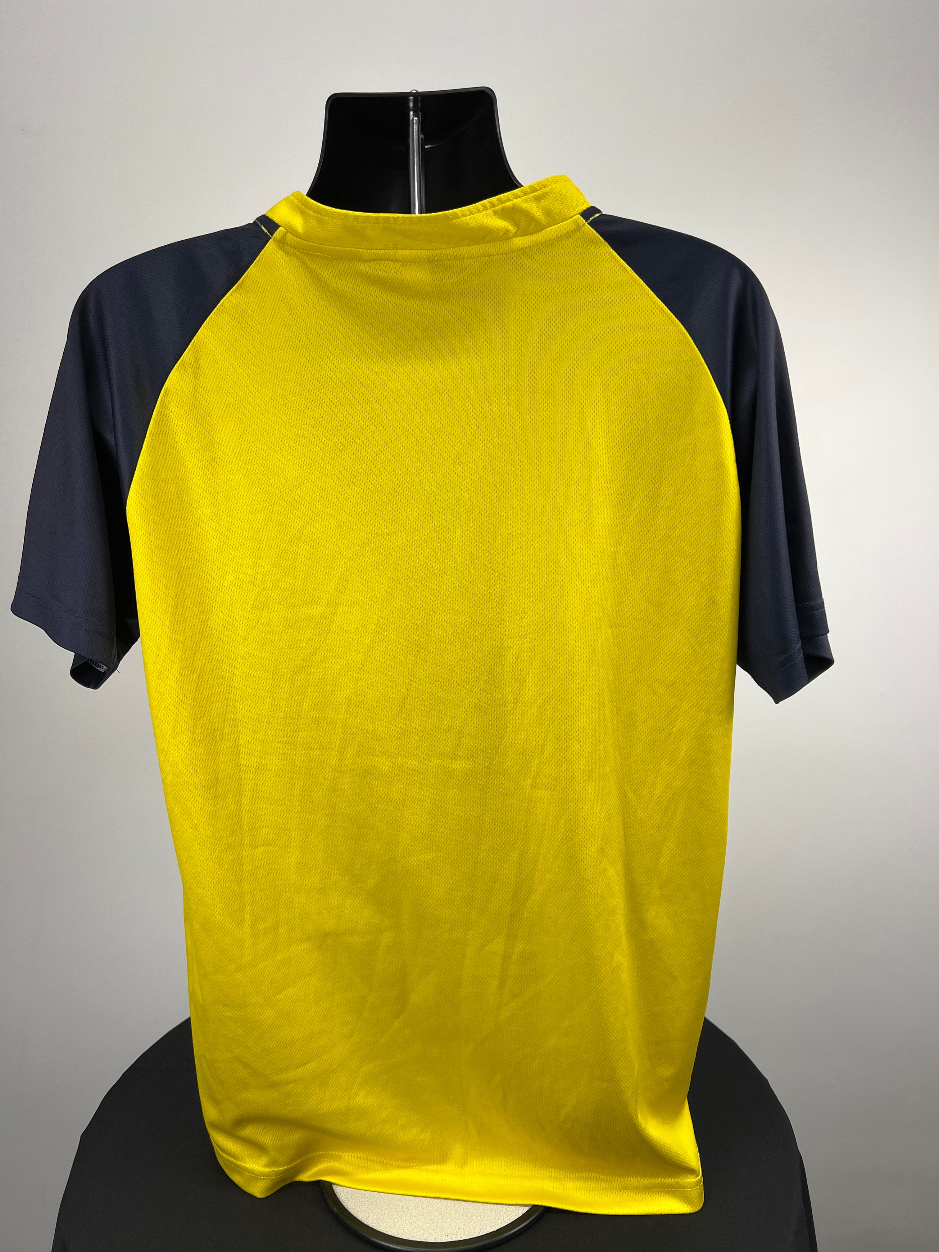 Back view of Hampshire Cricket yellow and navy sleeve top showing solid colour and raglan sleeve design