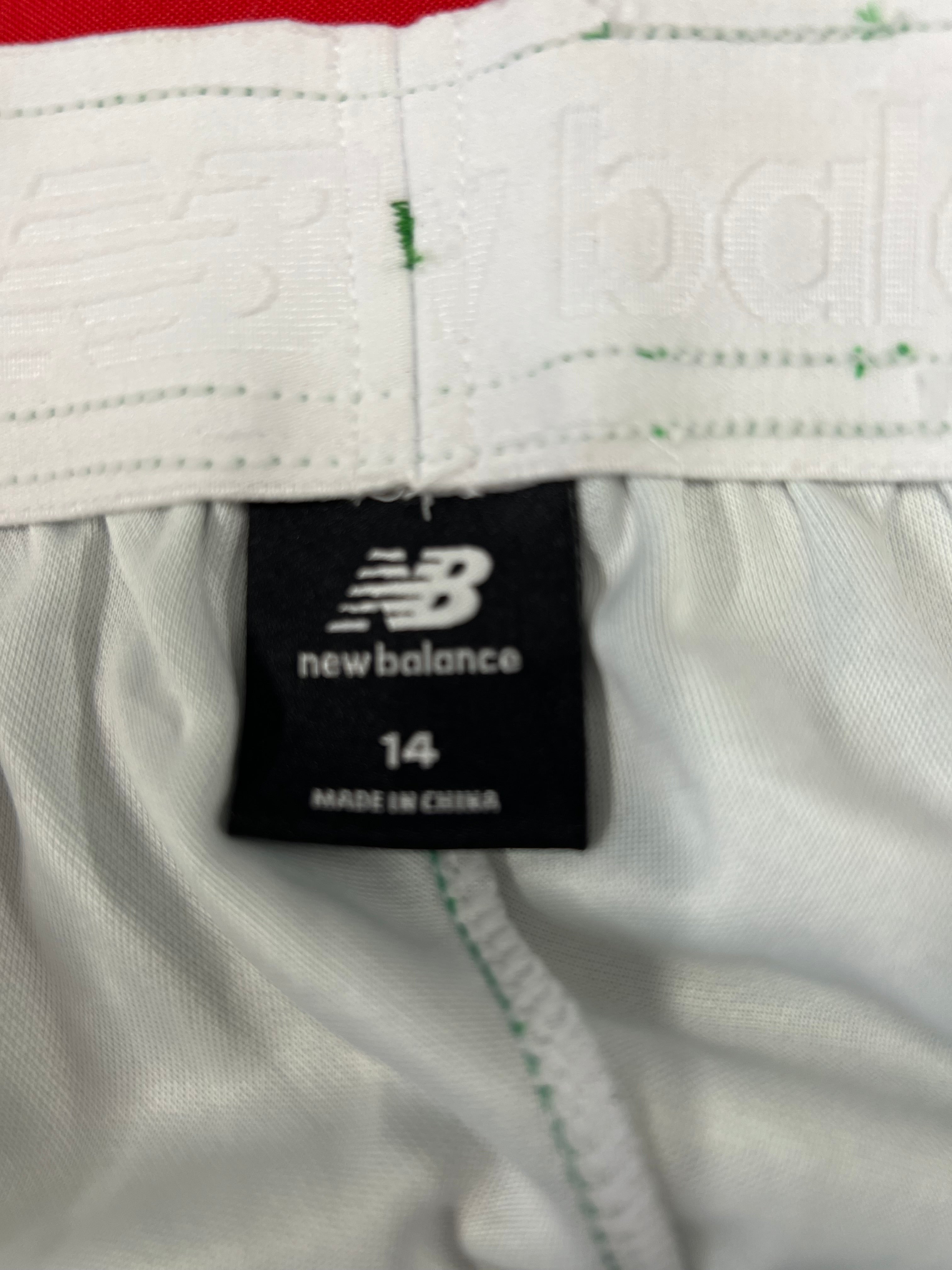 close-up of New Balance brand label inside waistband showing size 14 and made in China tag