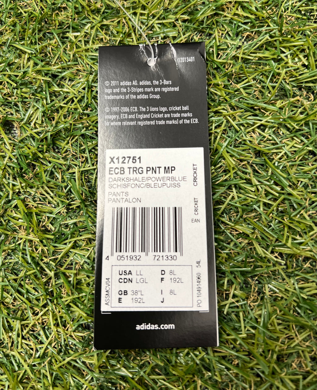 Product label showing size 38" L and colour dark shake/power blue on adidas ECB tracksuit bottoms