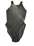 Front view of Adidas Infinitex black swimsuit with grey and orange graphic design on green grass