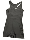 Front view of black Slazenger swimsuit size 10 lying flat on grass