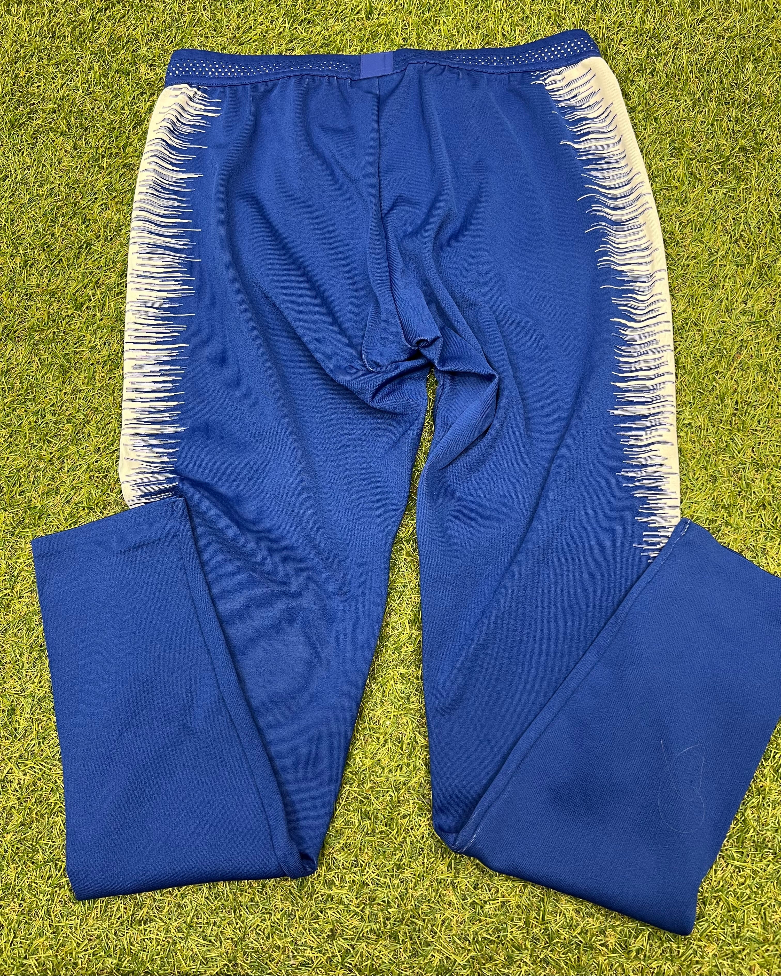 Back view of Chelsea FC royal blue training joggers showing white side panel details