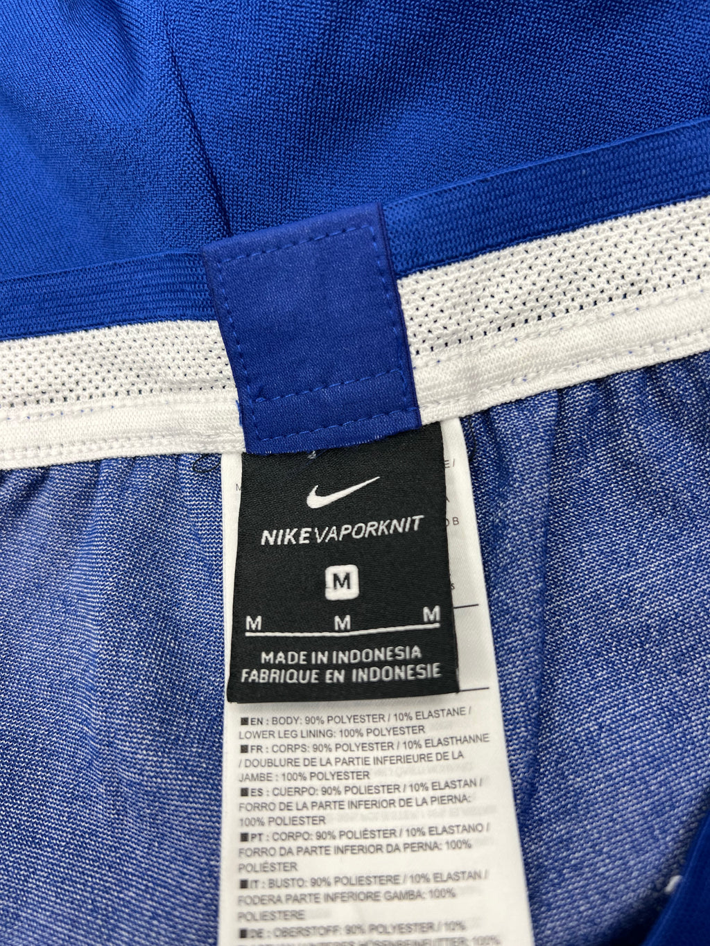 Nike VaporKnit material label inside Chelsea FC training joggers indicating 90% polyester and 10% elastane