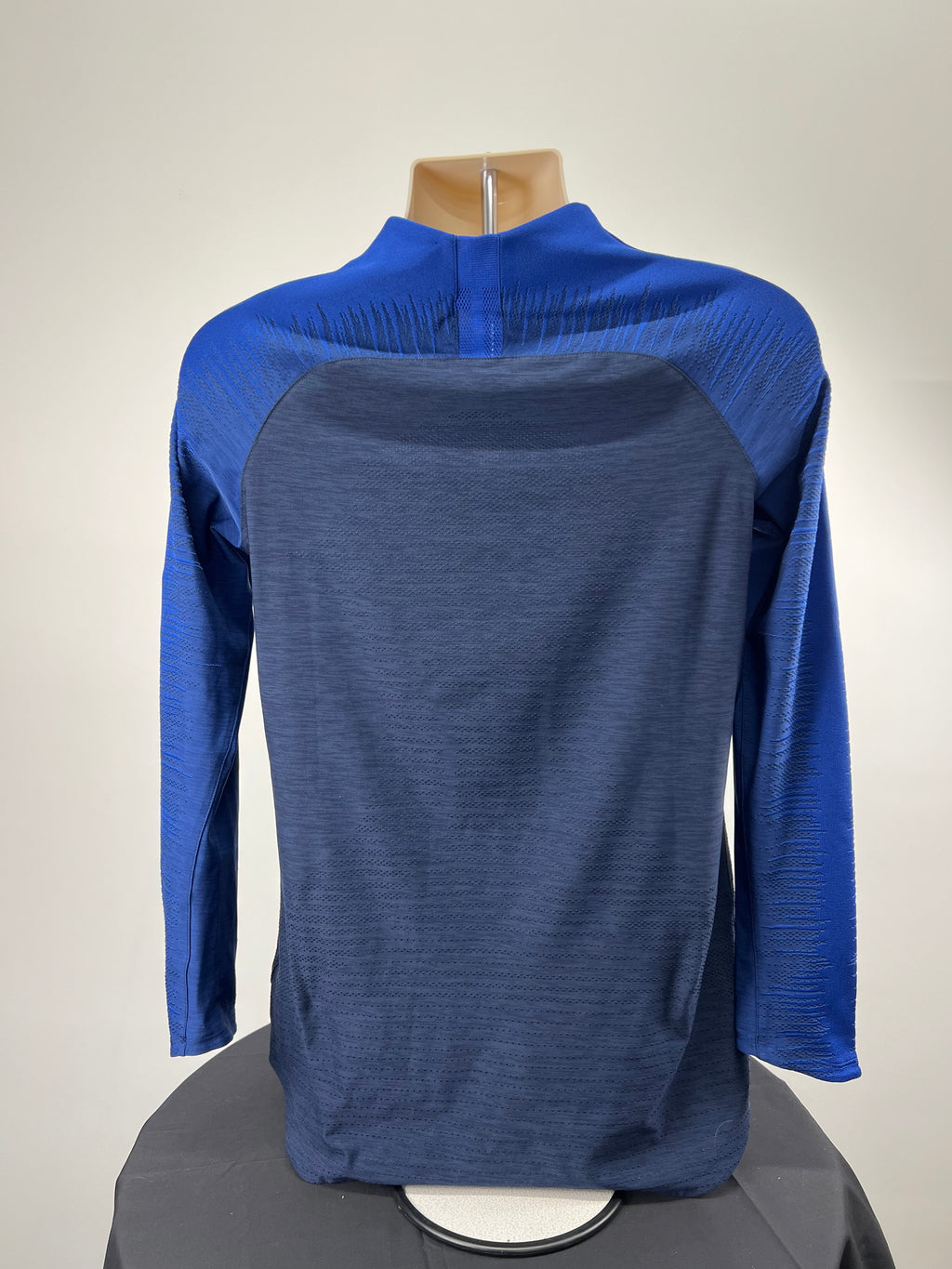 Back view of Chelsea FC Nike long sleeve training top showing textured fabric and raglan sleeves