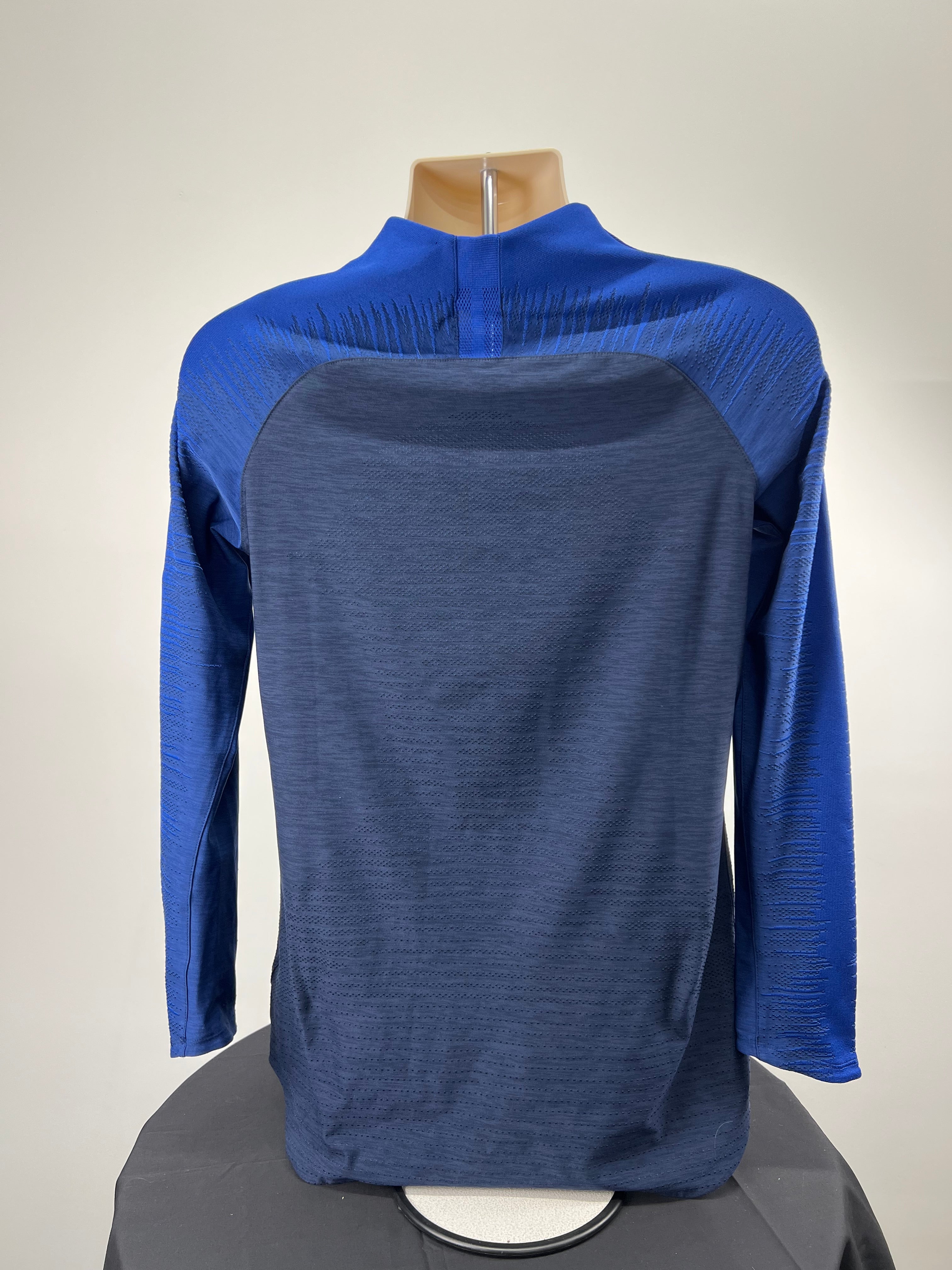 Back view of Chelsea FC Nike long sleeve training top showing textured fabric and raglan sleeves