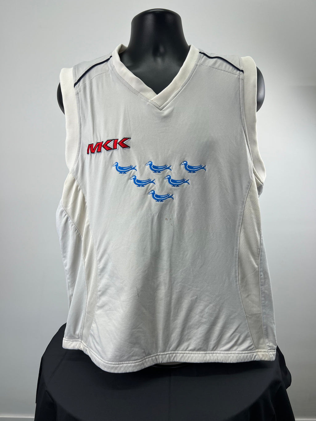Front view of Sussex County Cricket sleeveless jumper with MKK logo and Sussex bluebirds embroidery