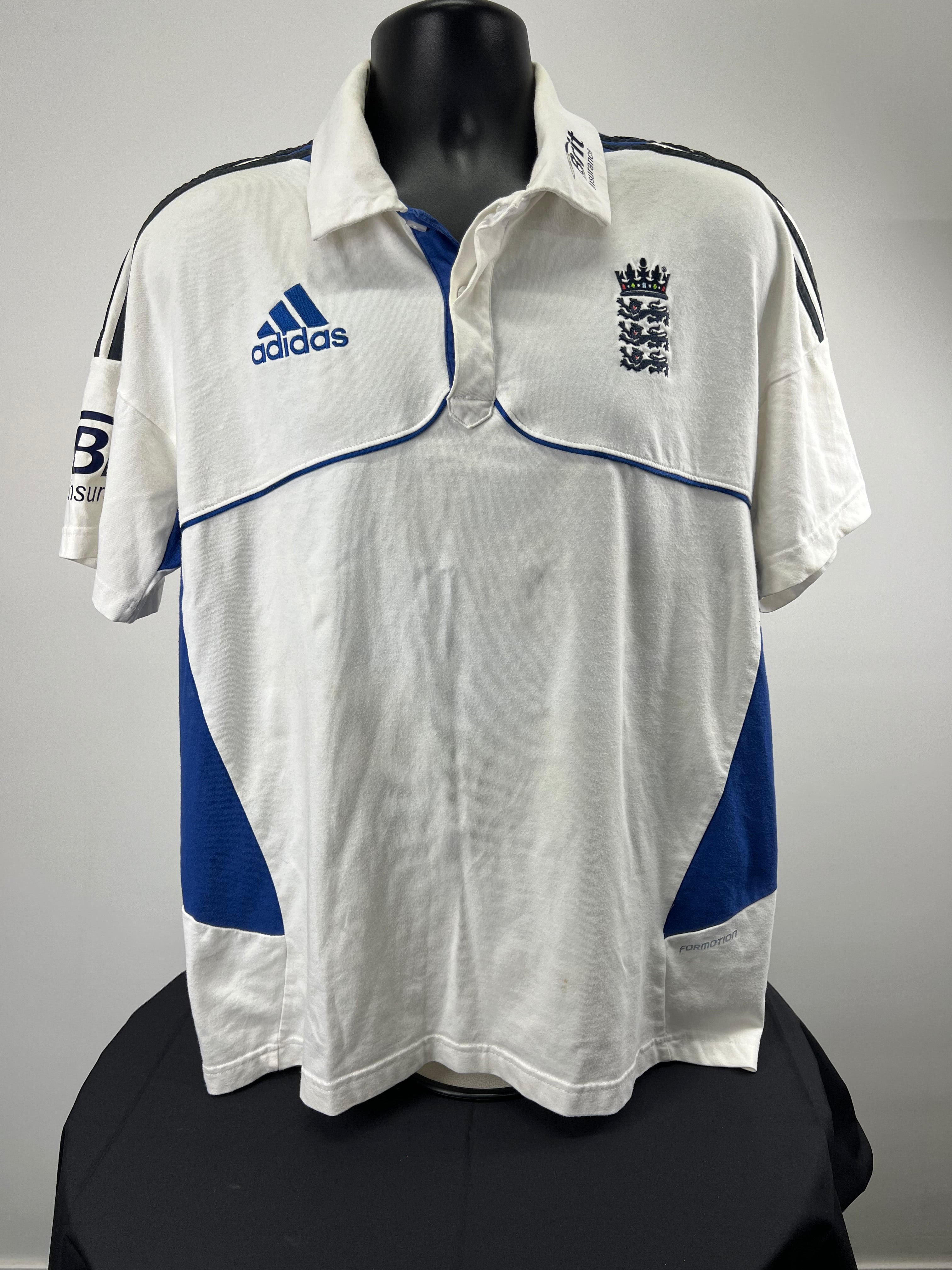 Front view of men's England cricket polo shirt XL with white and blue Adidas design