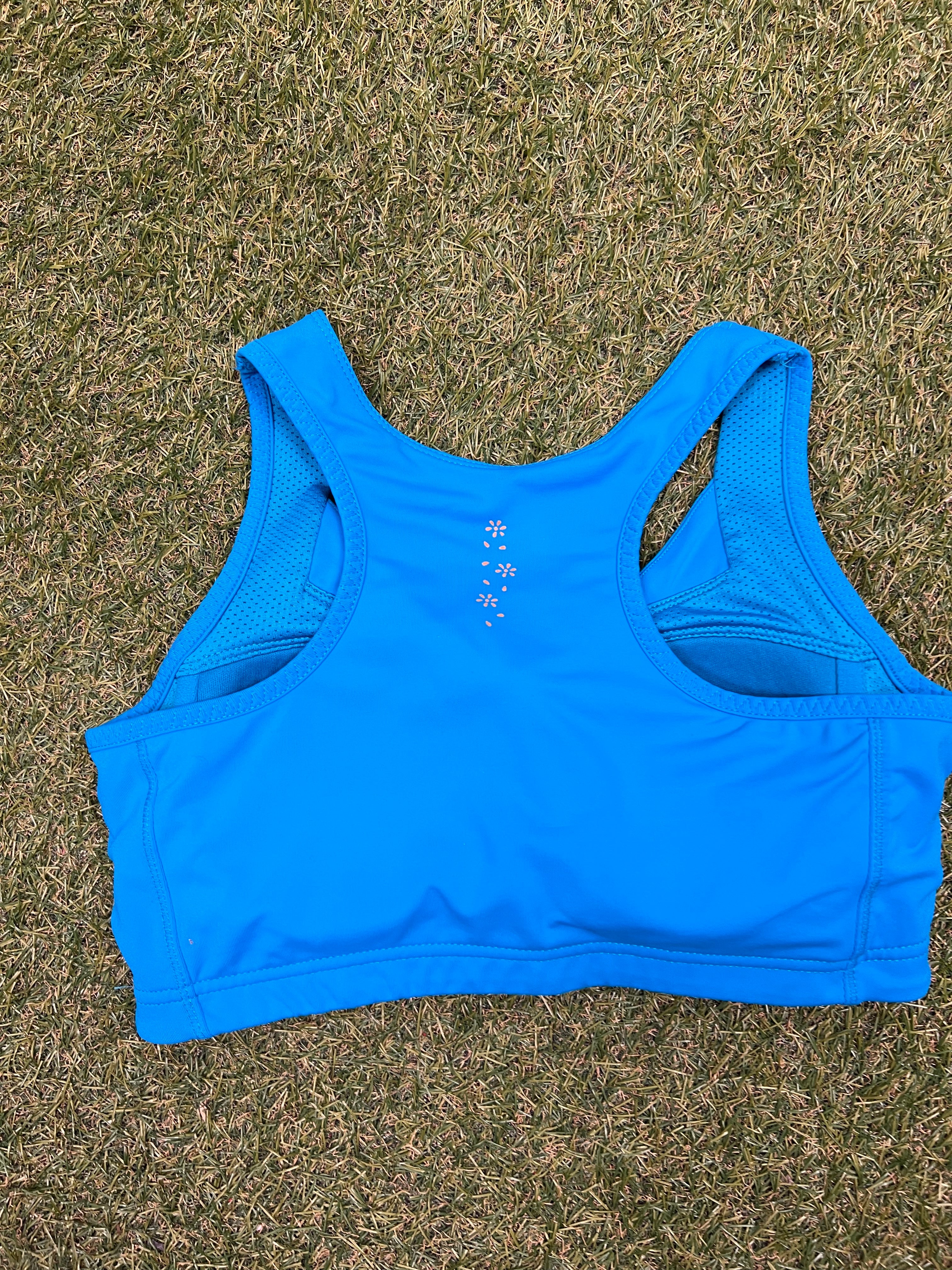 Back view of USA Pro turquoise sports bra showing racerback design