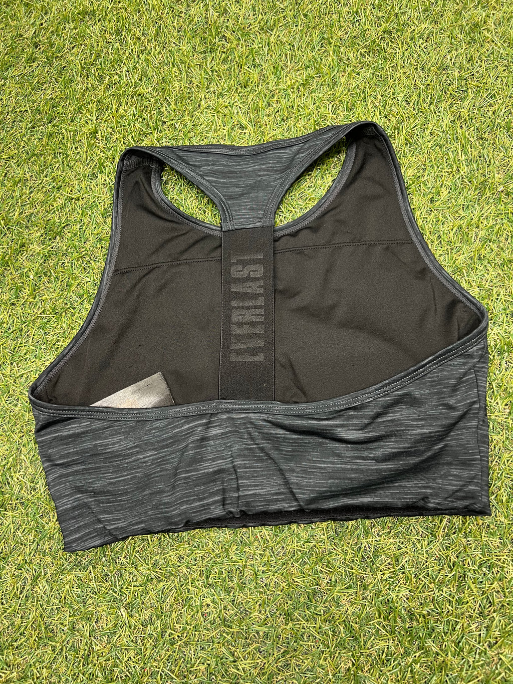 Rear view of black Everlast sports bra showing racerback design and branded elastic strap